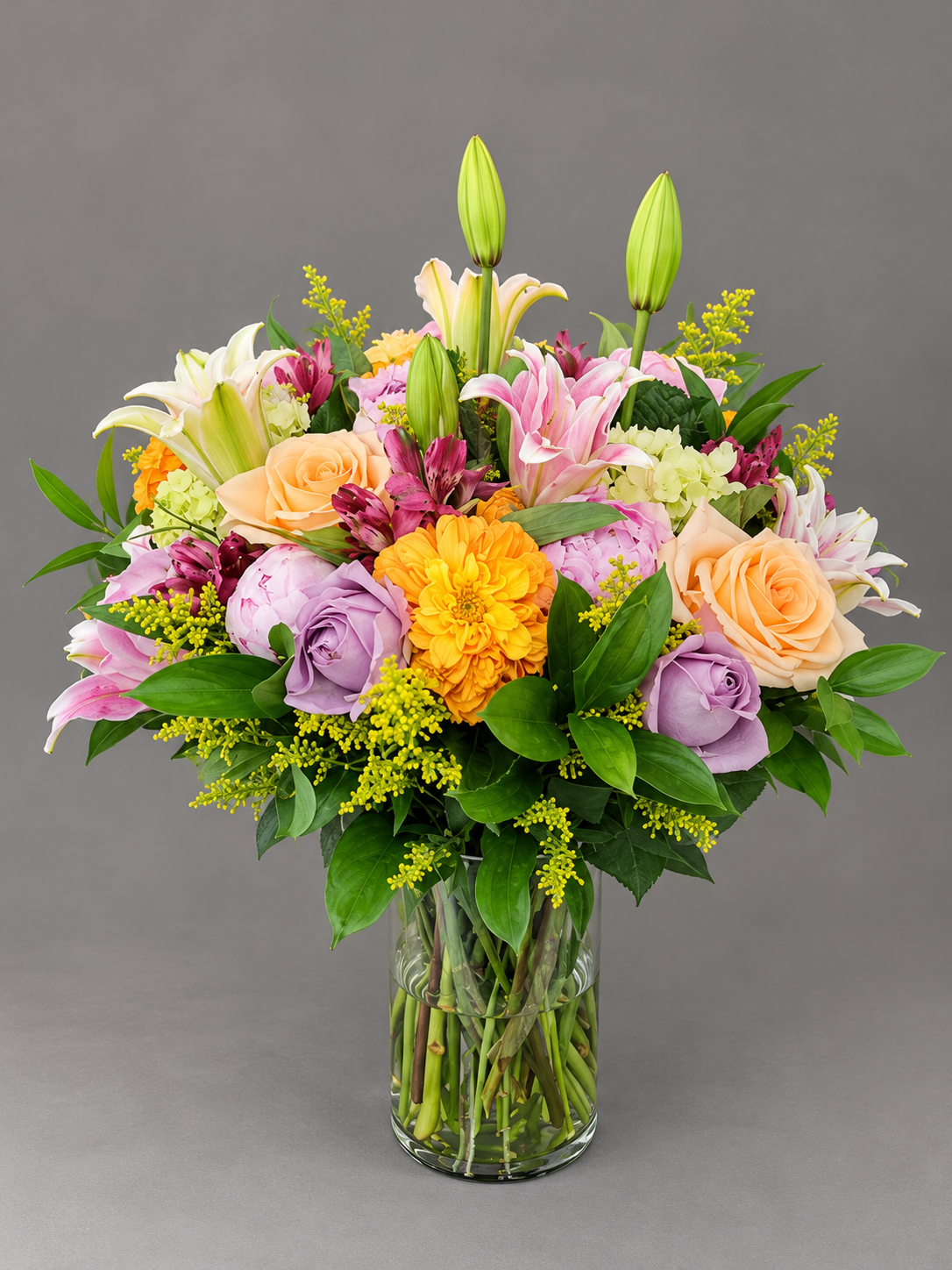 Elegant Mixed Flower Bouquet in Glass Vase.png