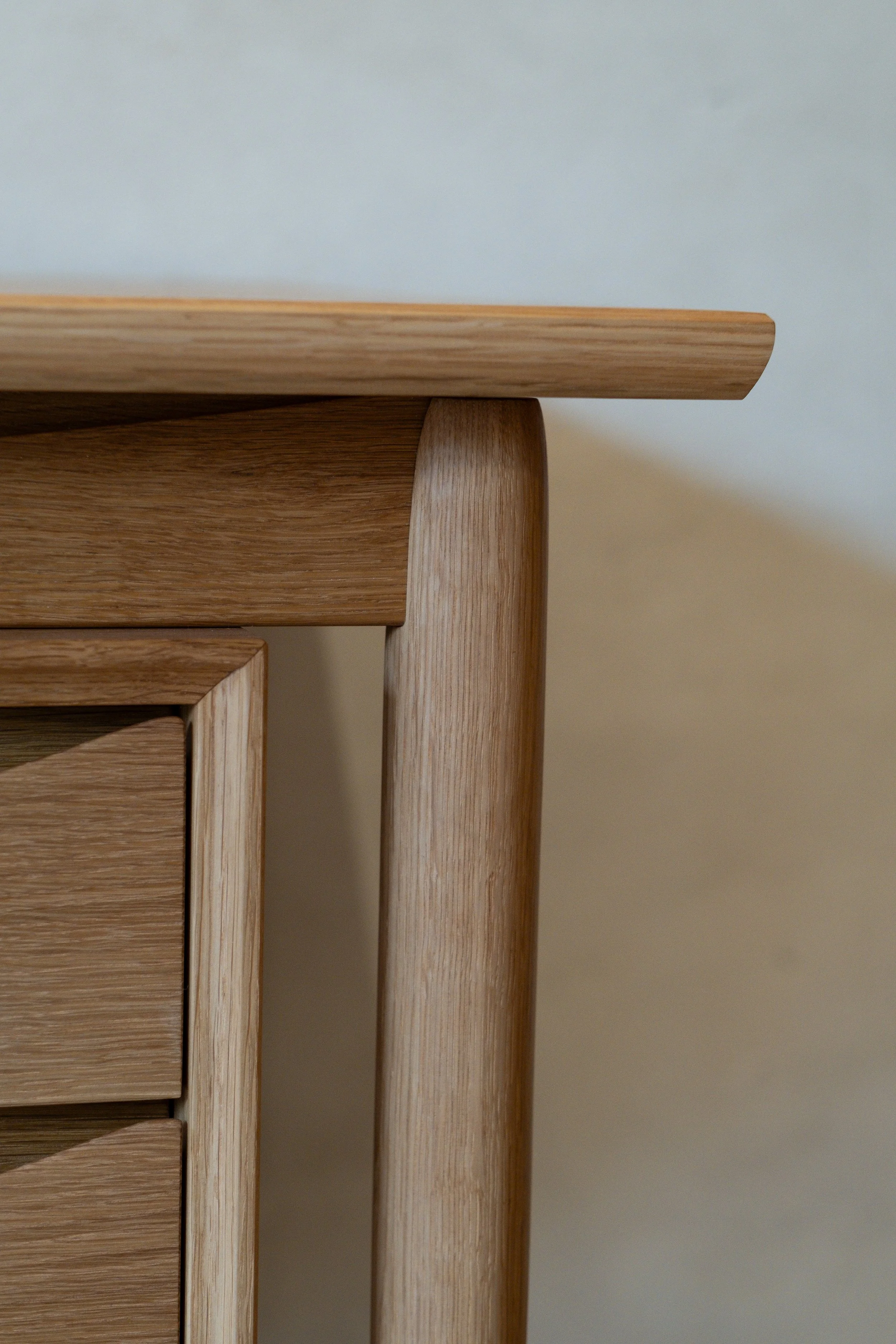 Close-up of Wren Desk tabletop overhang and lathe-turned leg joinery