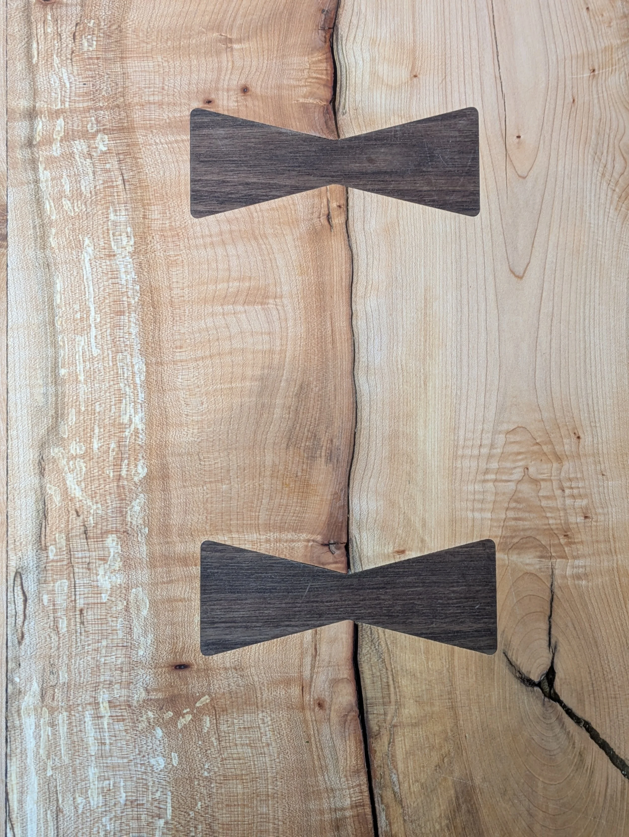Walnut dovetail key detail on live edge big leaf maple slab dining table