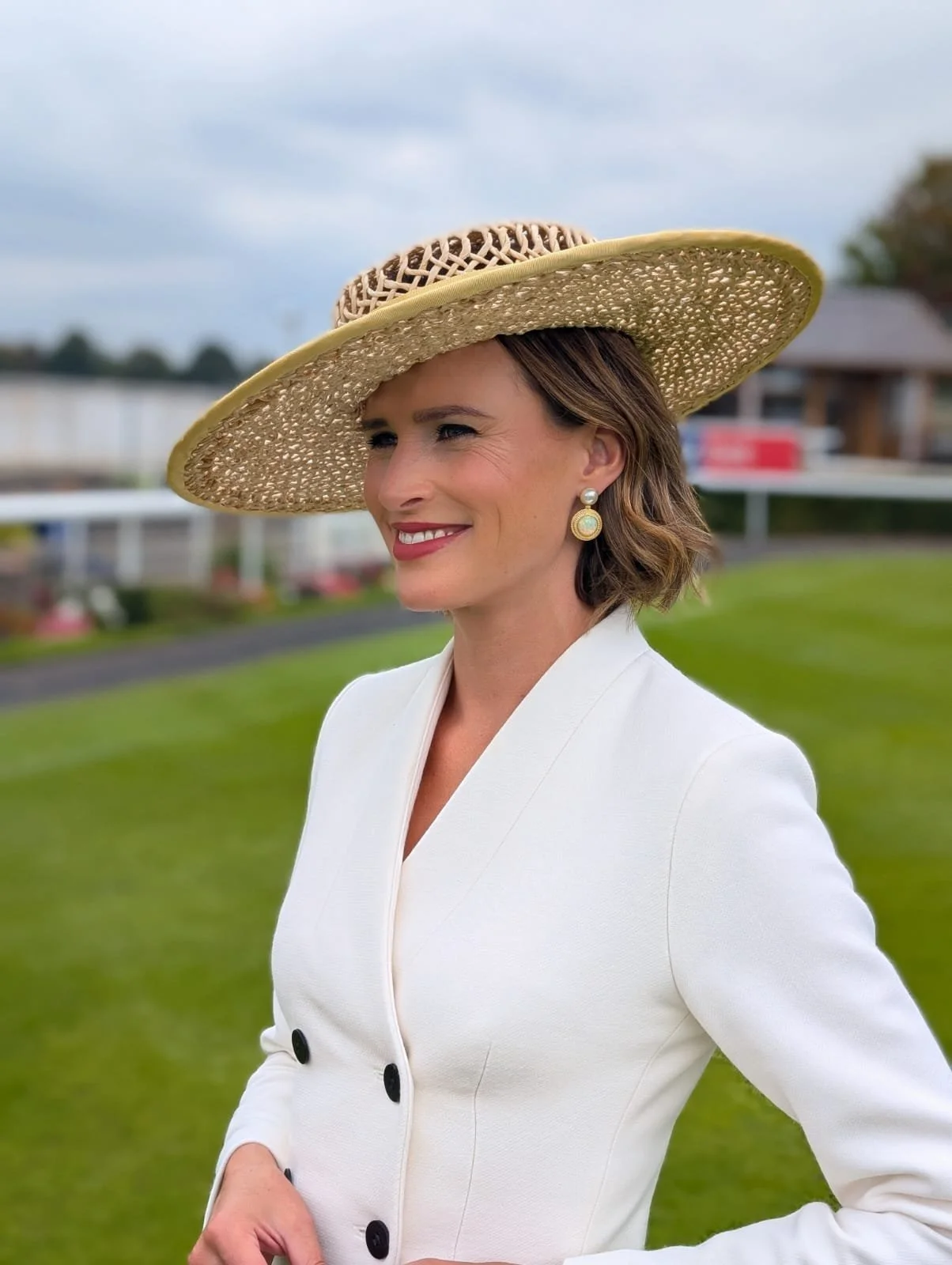 Francesca Cumani looking amazing in a large twisted raffia boater at York