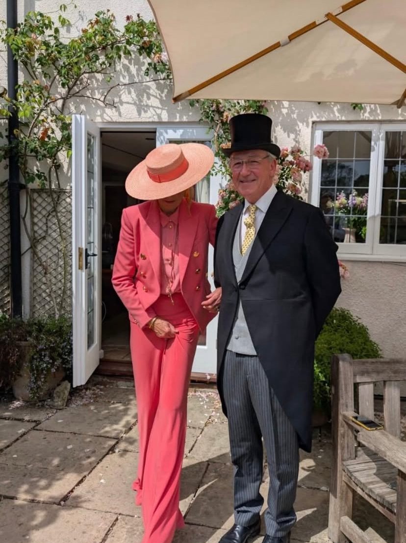 All ready for the races in a large pedal straw boater