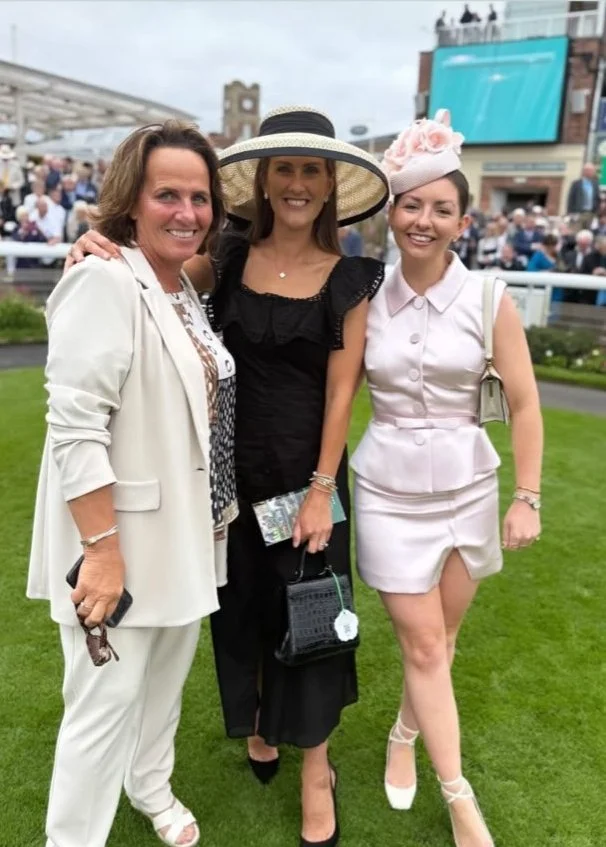 Jane Buick in a large sisal straw 'dior' down brim hat