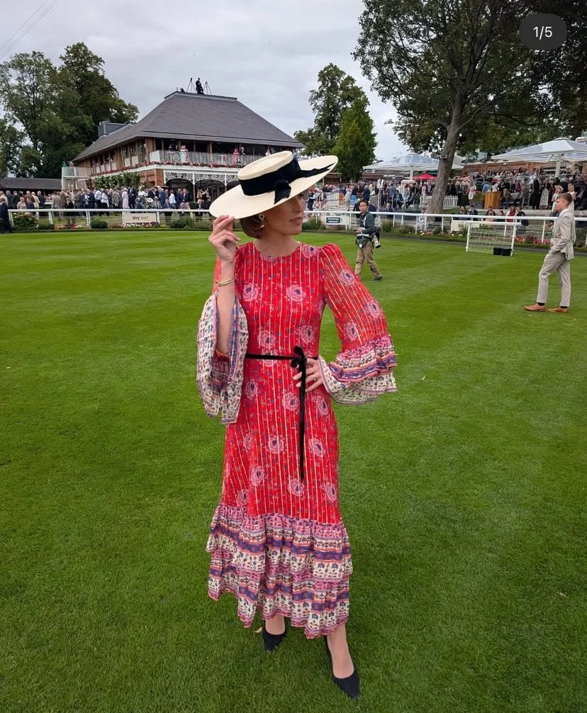 Francesca Cumani wearing a large natural boater at York Races