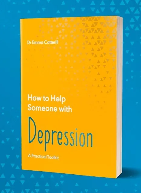 Photo of a yellow book titled "How to Help Someone with Depression" by Dr. Emma Cotterill, placed against a blue background with small triangle patterns.