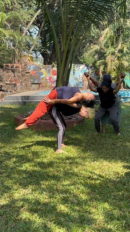 Participants exploring body movement and contemporary dance during a movement workshop at The Art Farm, Goa -  creative expression in nature, India