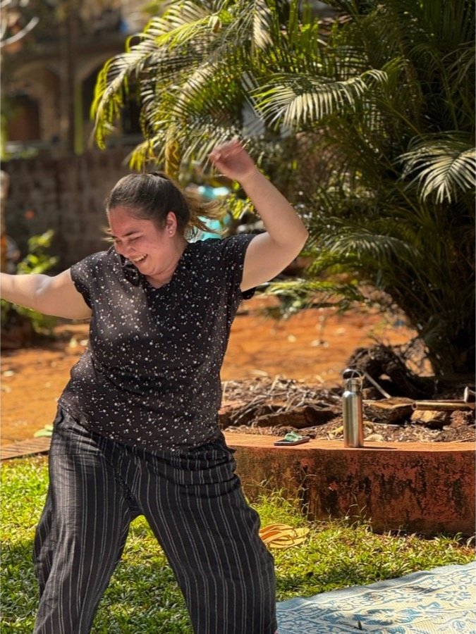 Participants exploring body movement during a dance workshop at The Art Farm, Goa - outdoor creative practice in India