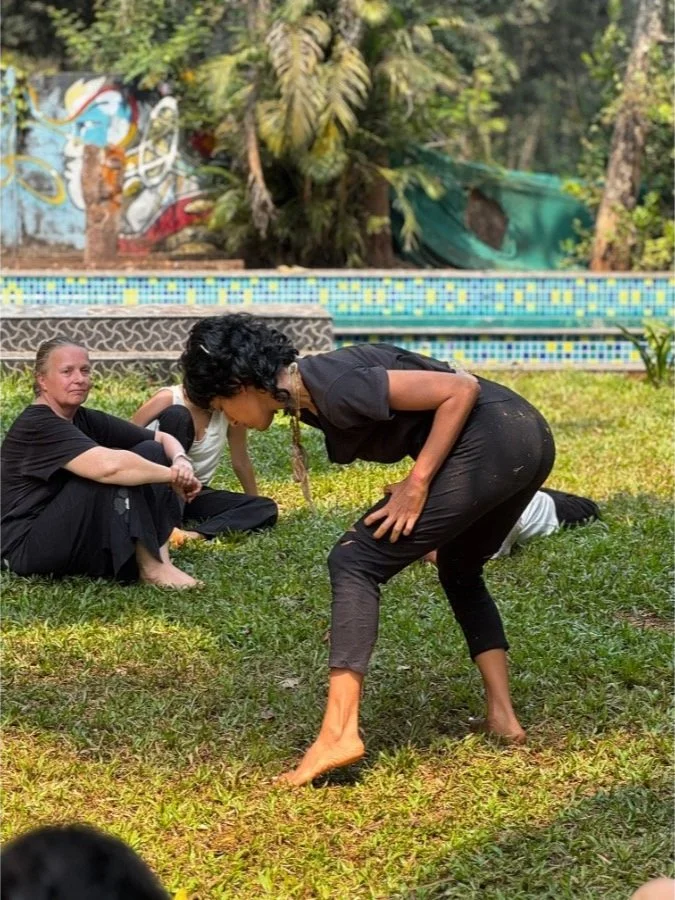 Participant practicing expressive body movement  and dance during an outdoor session at The Art Farm, Goa - dance and movement retreat in India.
