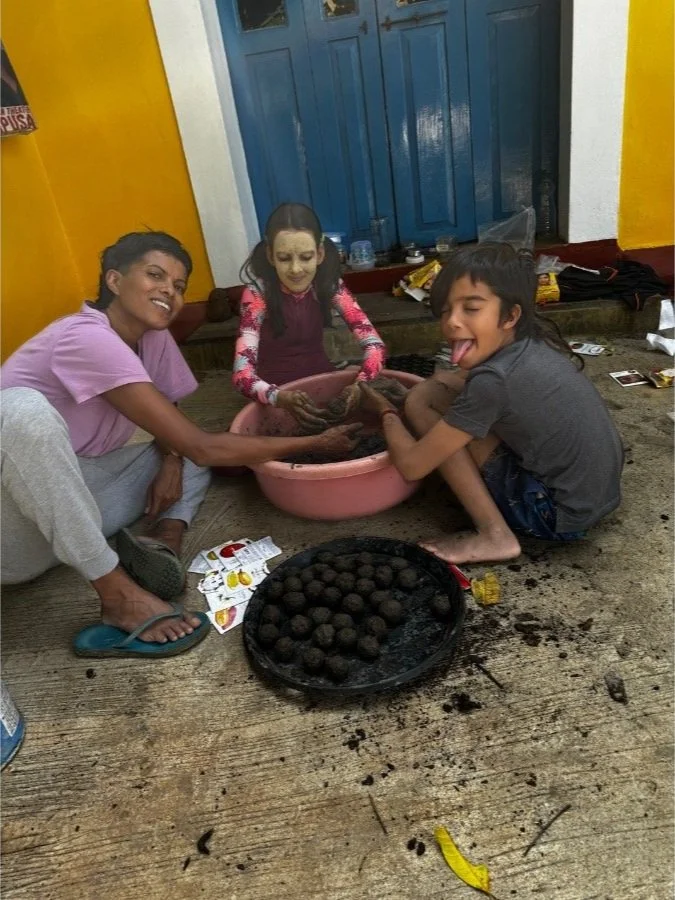 Children making seed bombs during a sustainability workshop at The Art Farm, Goa - hands-on eco activity and playful learning in India