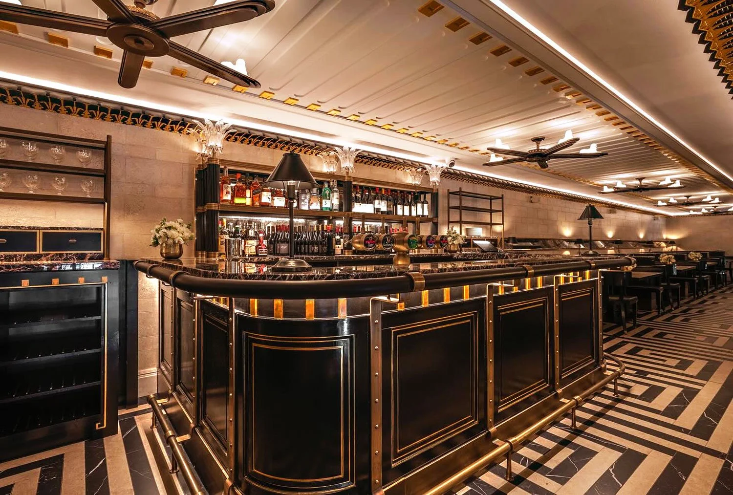 Ceiling border frieze in black and gold leaf. Wall panels faux Portland stone wall pannels.