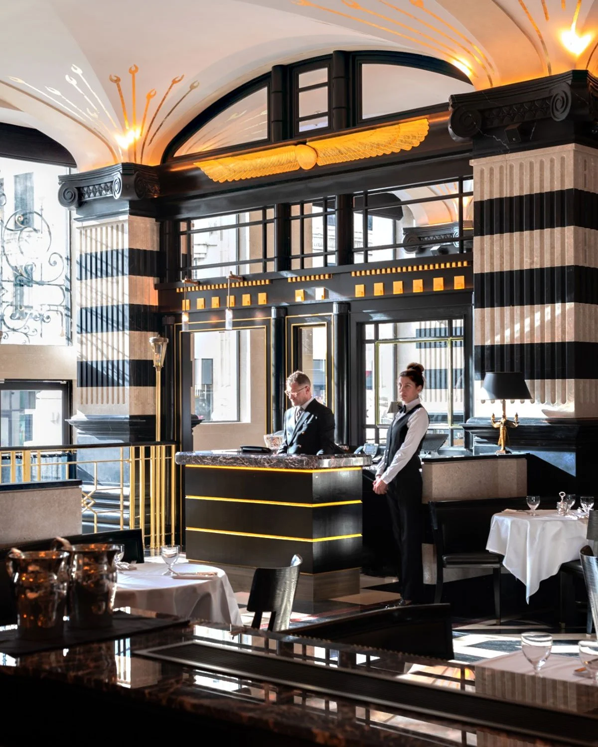 Winged sculptures and ceiling detail in gold leaf.