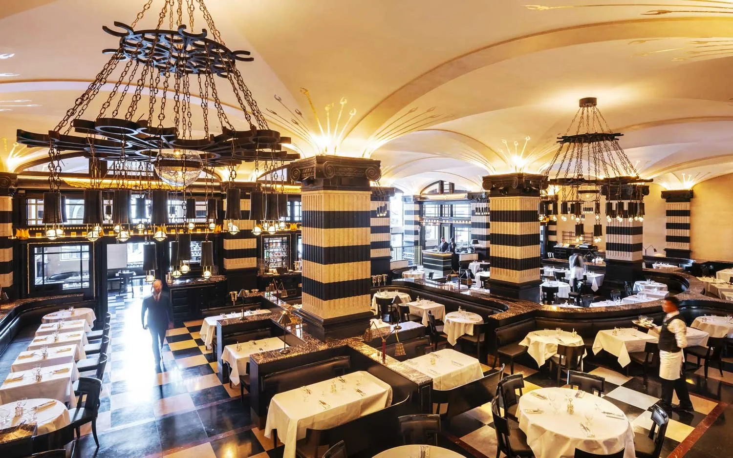 Vaulted ceiling, gold leaf details and faux marble plaster column caps.