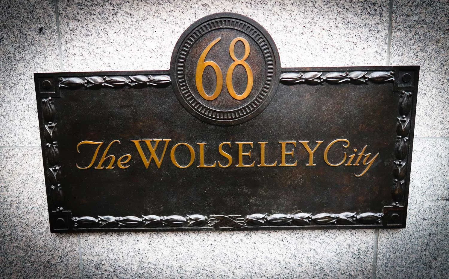 Solid cast bronze sign.