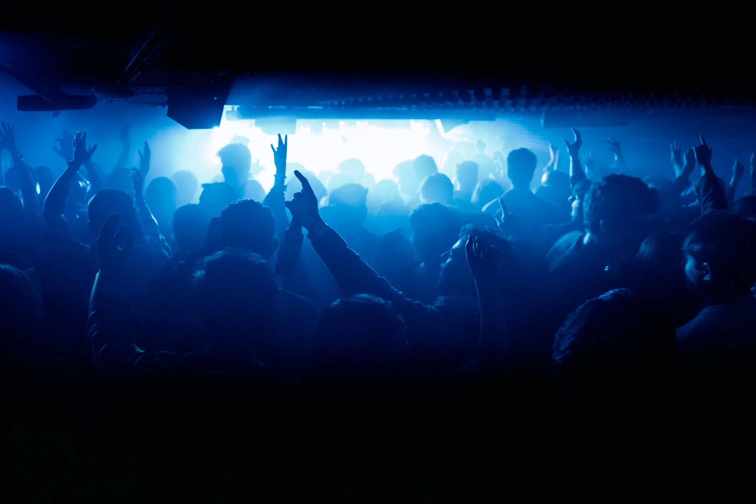 A large crowd of people dancing at gallery club london to a house music set by prospa - the club is busy and everyone is having a good time