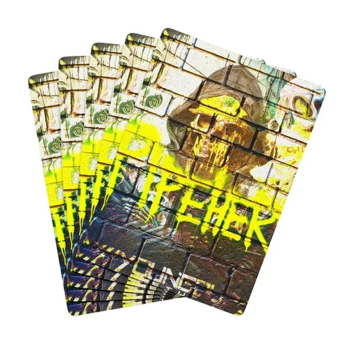 Graffiti-style cards with yellow and black spray paint on brick wall background.