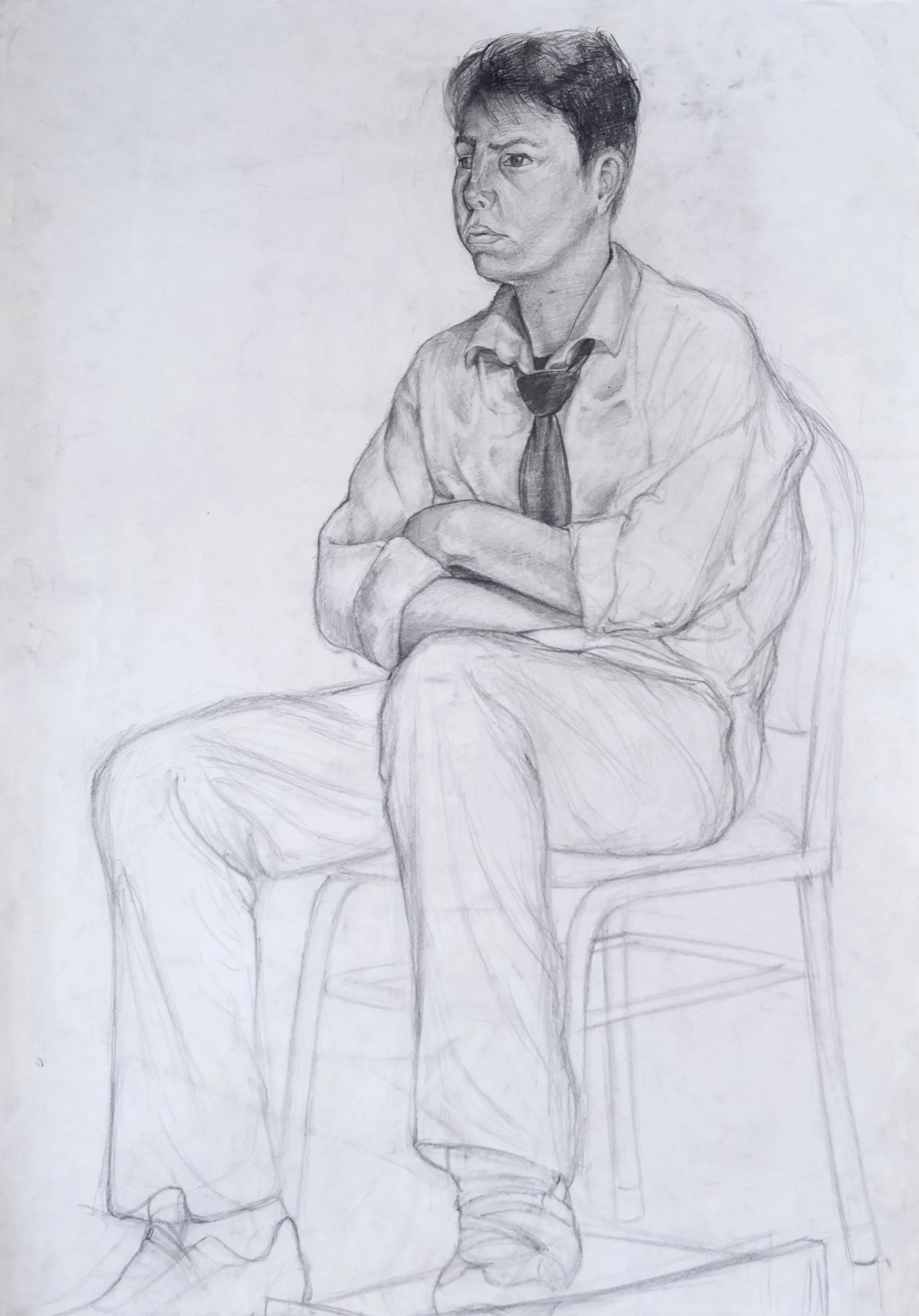 A detailed pencil sketch of a young man sitting on a chair with arms crossed, wearing a shirt, tie, and pants, with a serious expression.