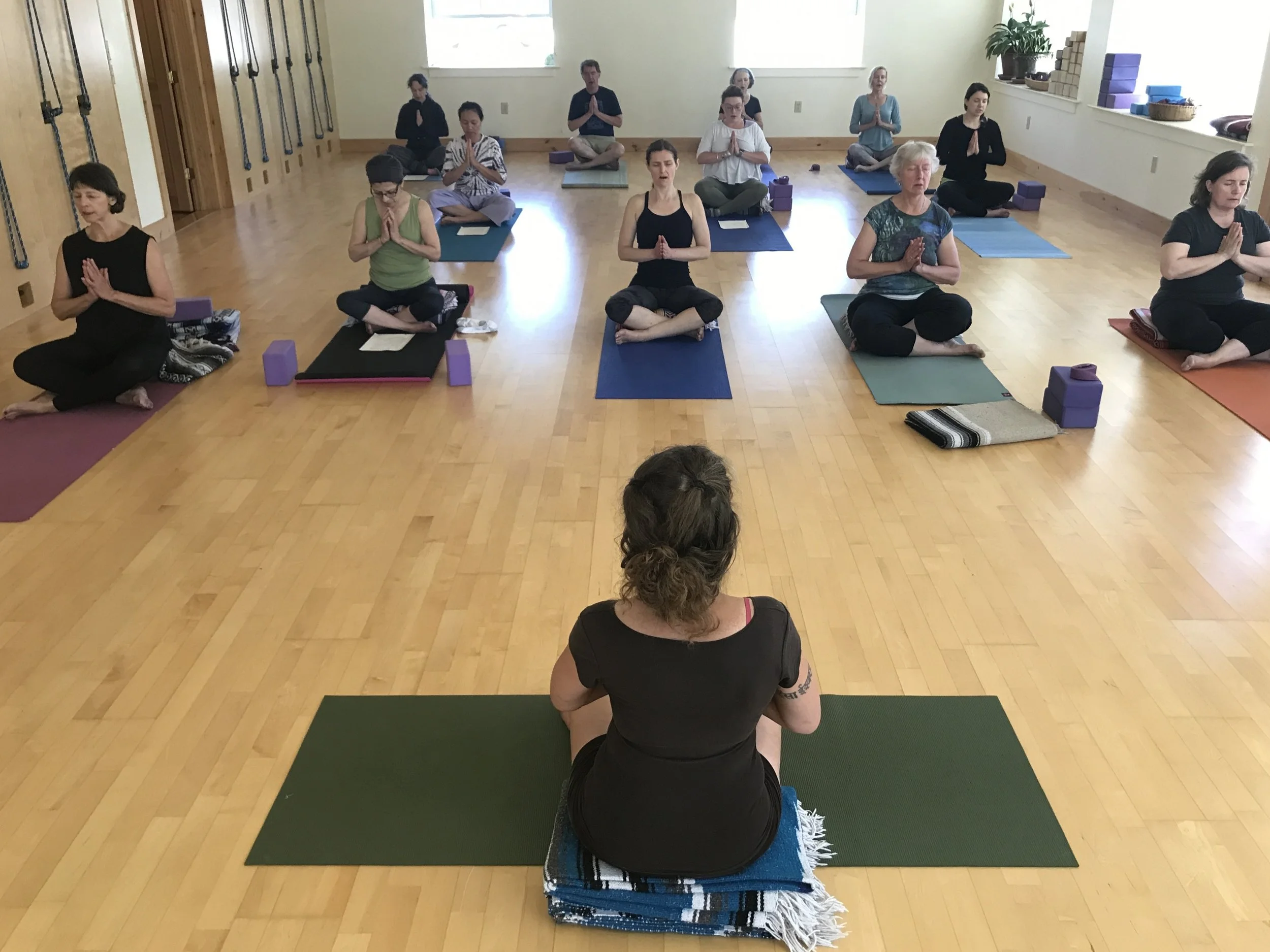 A photo of a yoga class at Otter Creek Yoga
