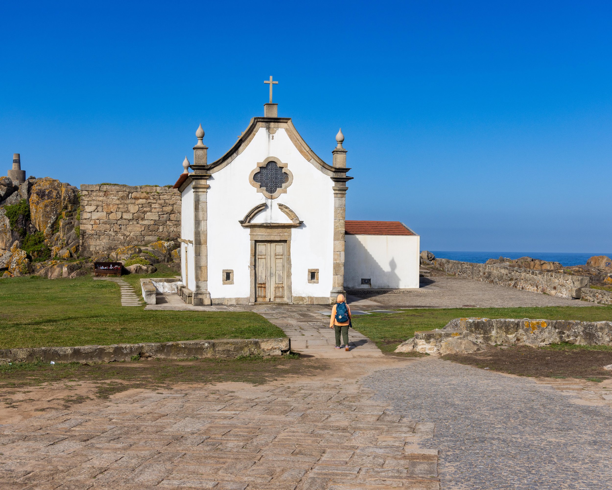 The Capela da Boa Nova, also known as the Ermida de São Clemente das Penhas (Chapel of Saint Clement of the Rocks), is a historic 14th-century coastal chapel located in Leça da Palmeira 