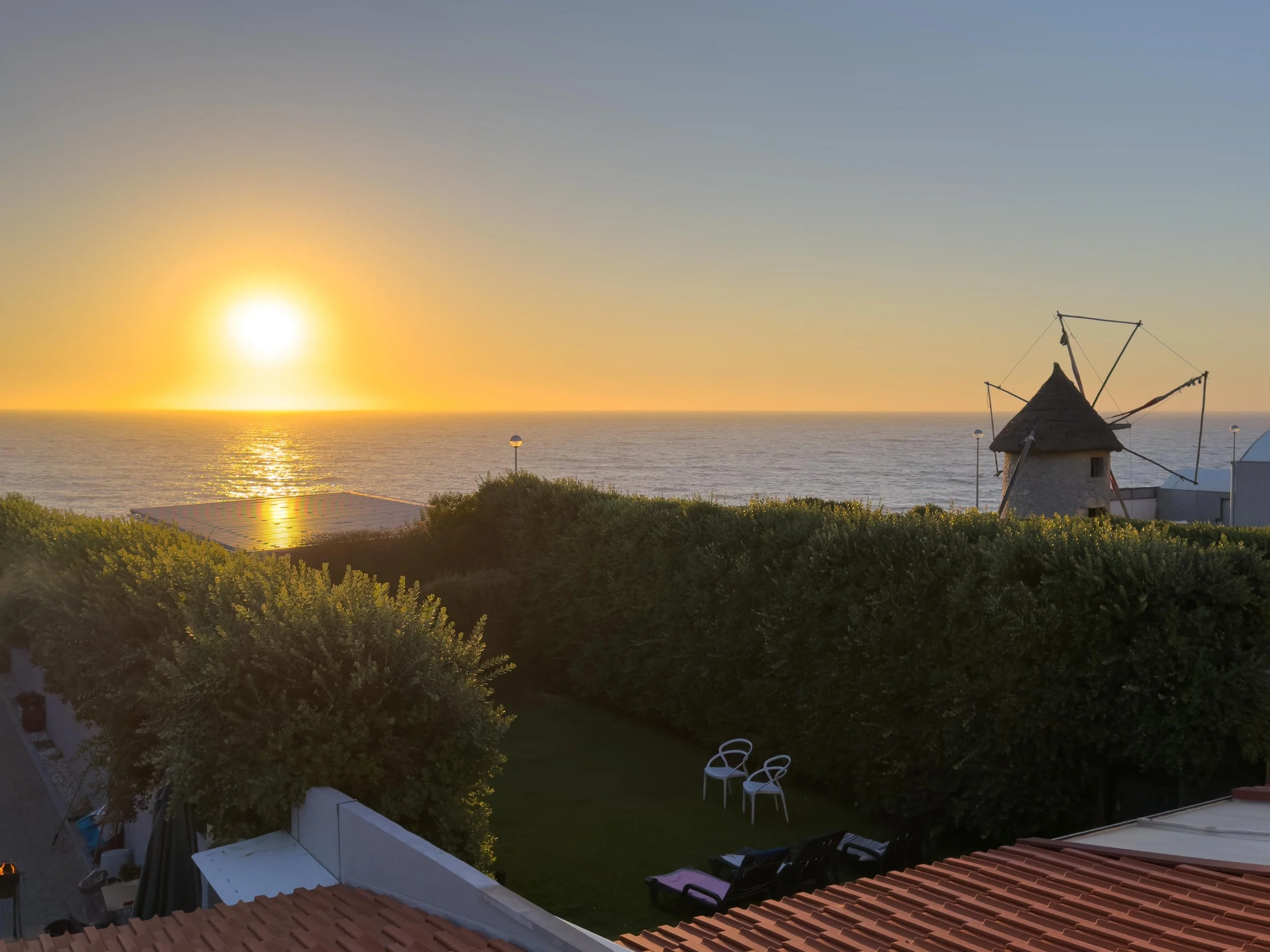 Setting sun over the Atlantic from the shared rooftop balcony at our alburgue.