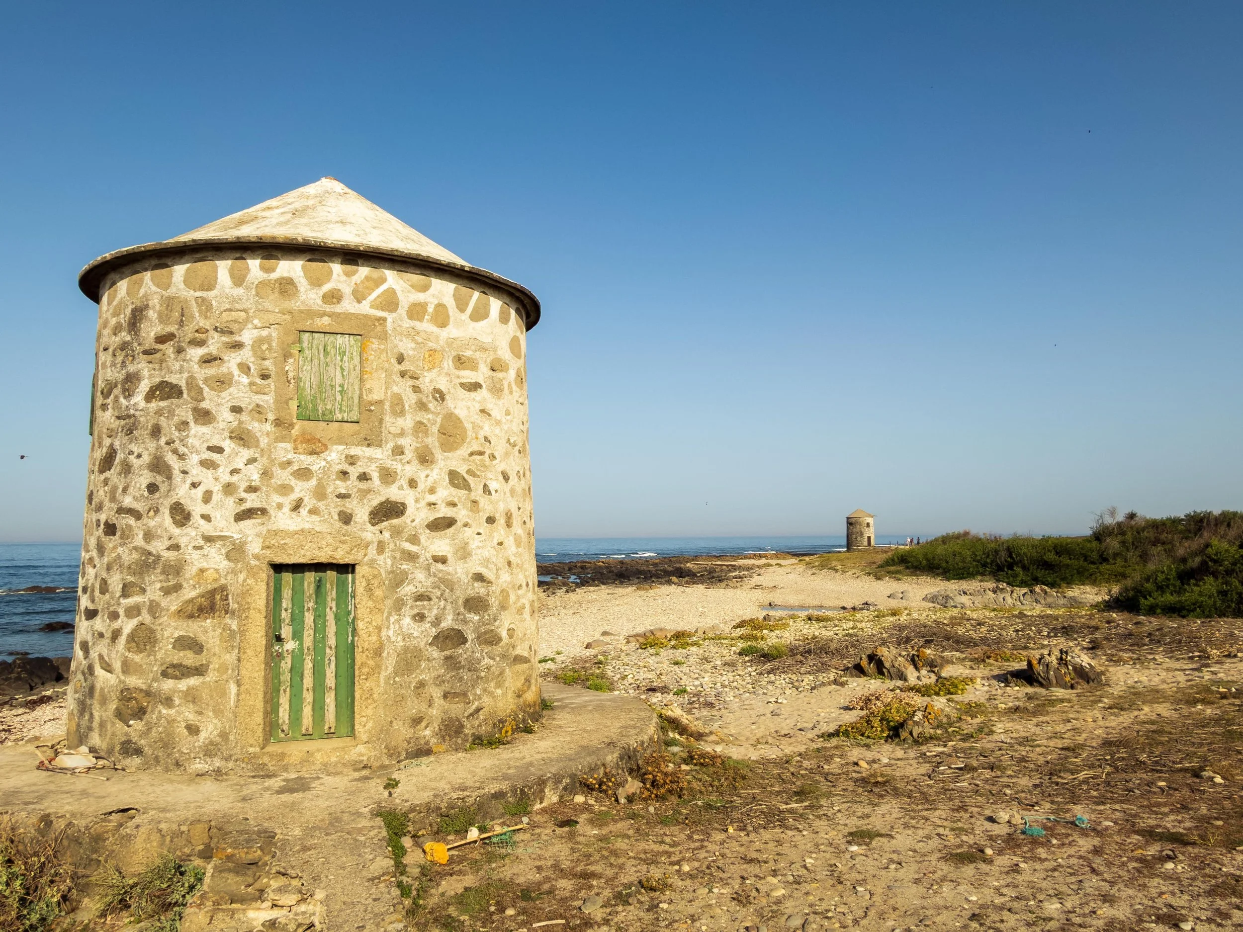 These were very common along this stage off the Camino.  The traditional round stone buildings found directly on the beaches and dunes of the Atlantic coast in Portugal—most famously in Apúlia (Esposende)—were originally built as windmills (moinhos d
