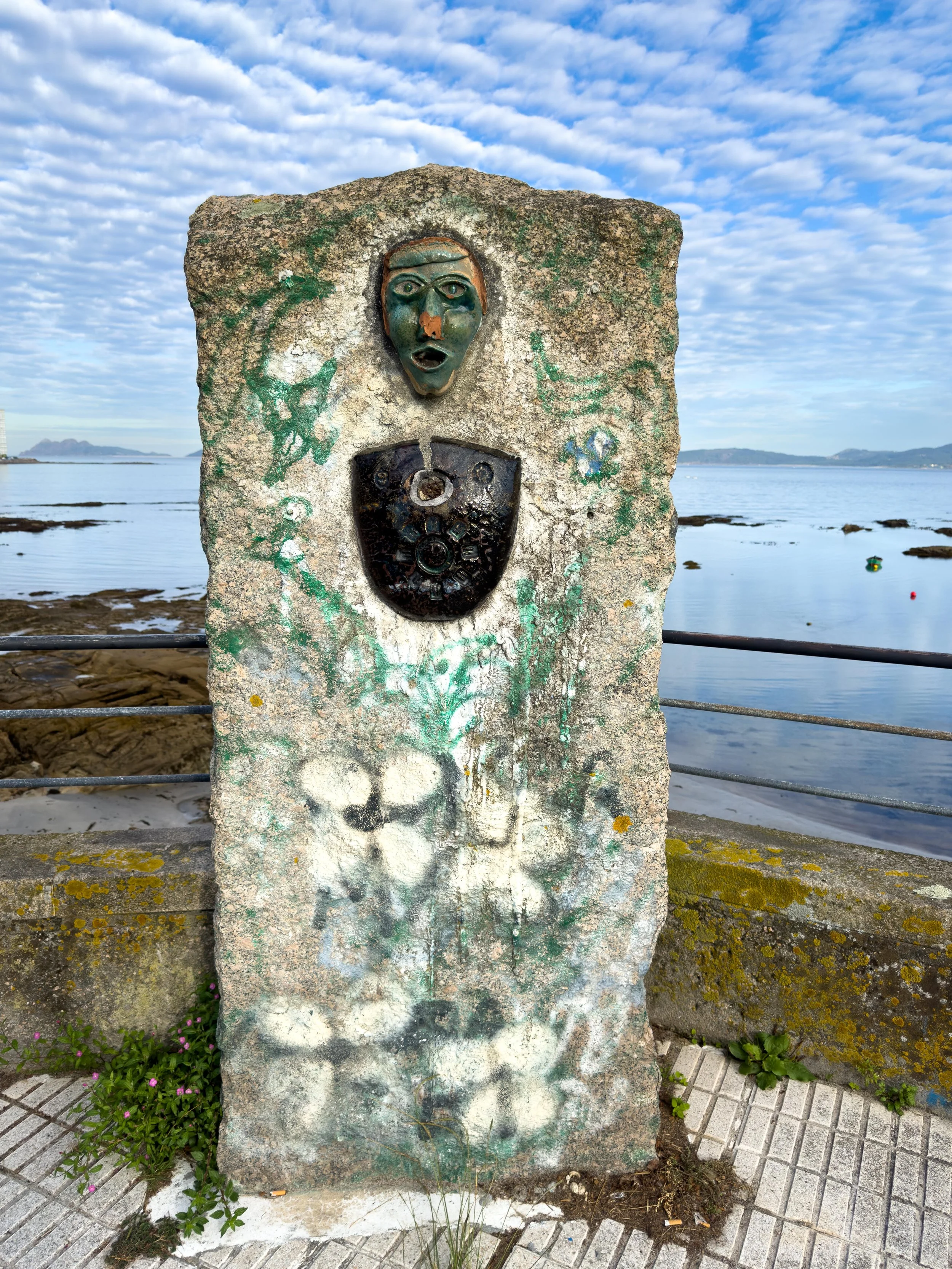 Coastal stone art along Rúa de Canido.  Vigo and the surrounding region of Galicia are deeply rooted in granite-working traditions. The local stone craft culture ranges from massive civic monuments to anonymous, smaller decorative pieces. This partic