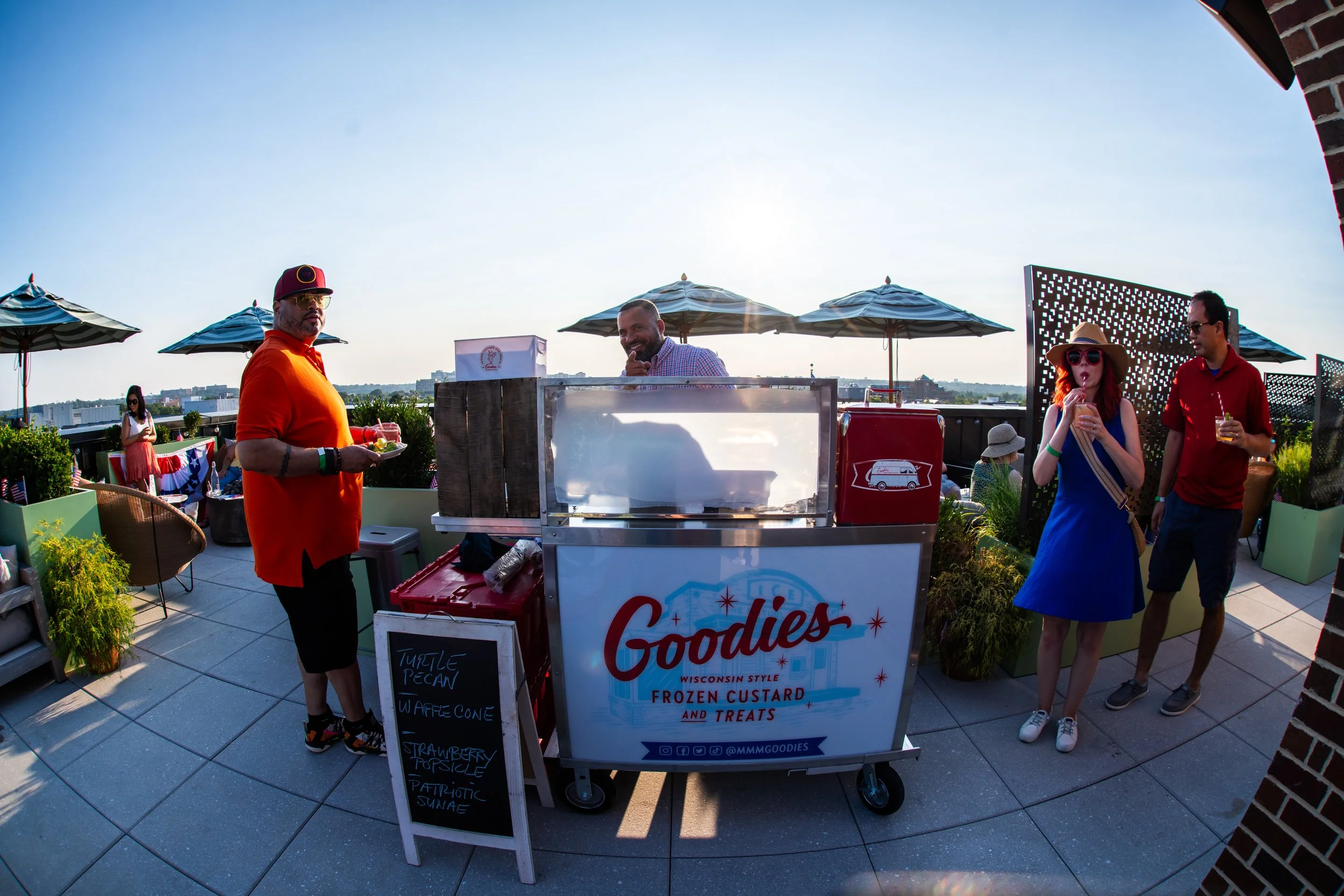 Brandon Byrd, owner of Goodies, a frozen custard and treats shop in Alexandria, Virginia standing in Good Fortune Rooftop at Hotel Heron 