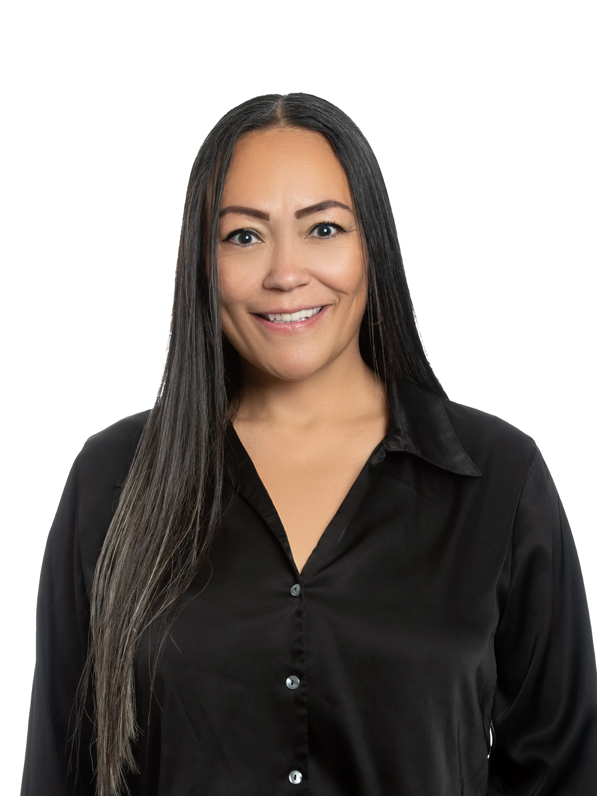 Woman wearing black dress shirt with long hair smiling at camera