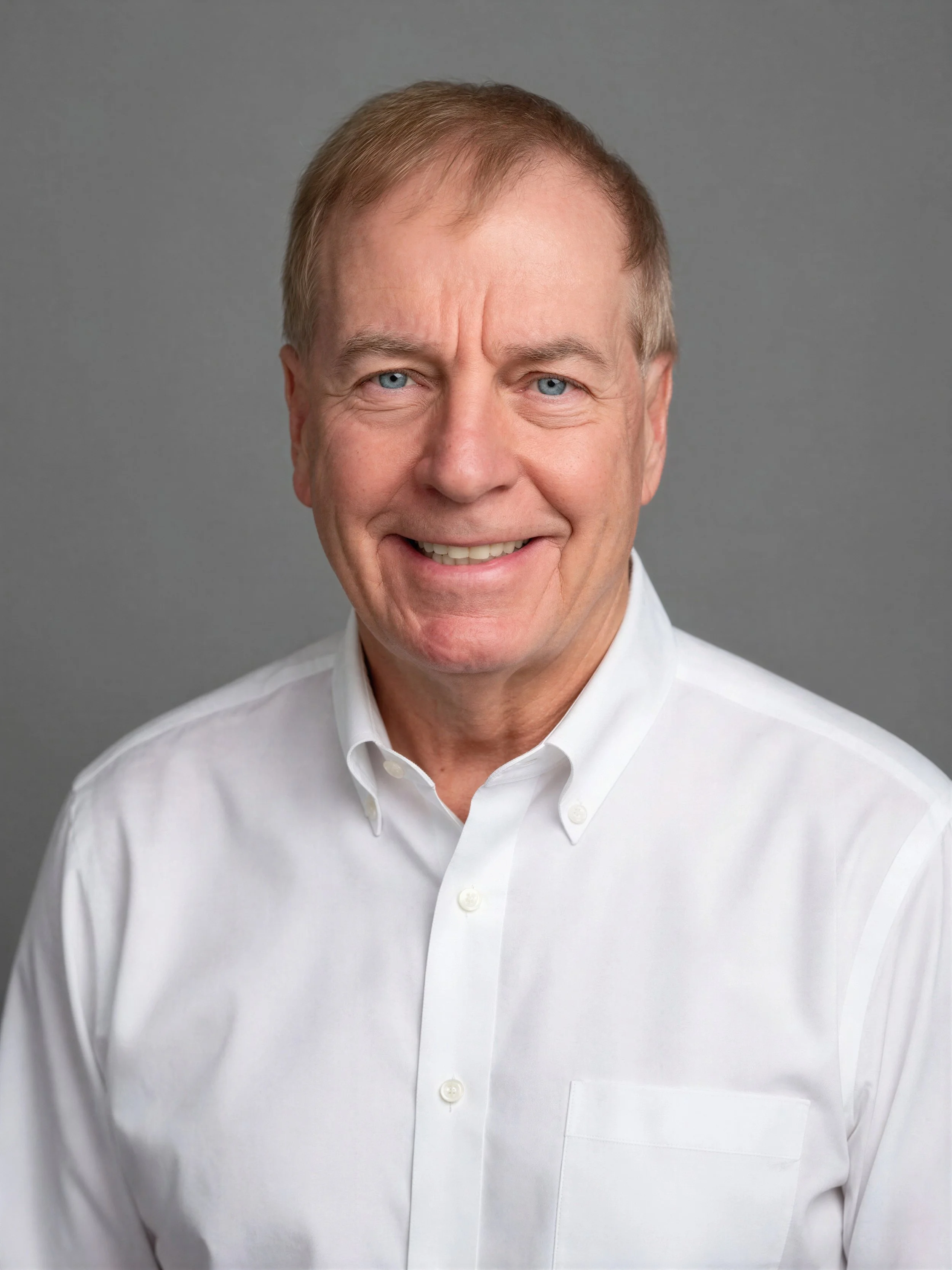 man in white shirt smiling
