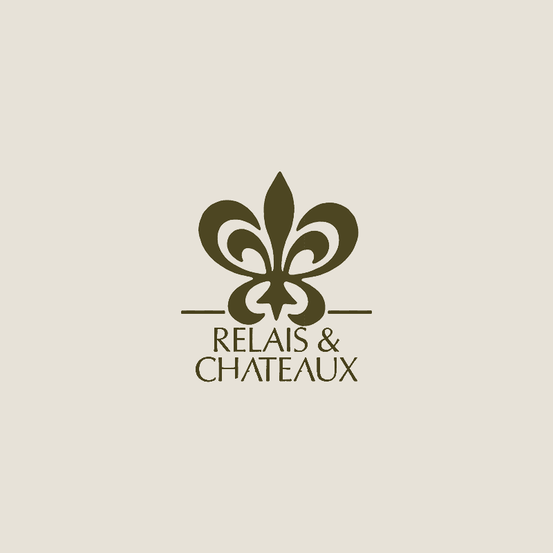 Logo featuring a stylized fleur-de-lis with the text 'RELAIS & CHATEAUX' beneath it.