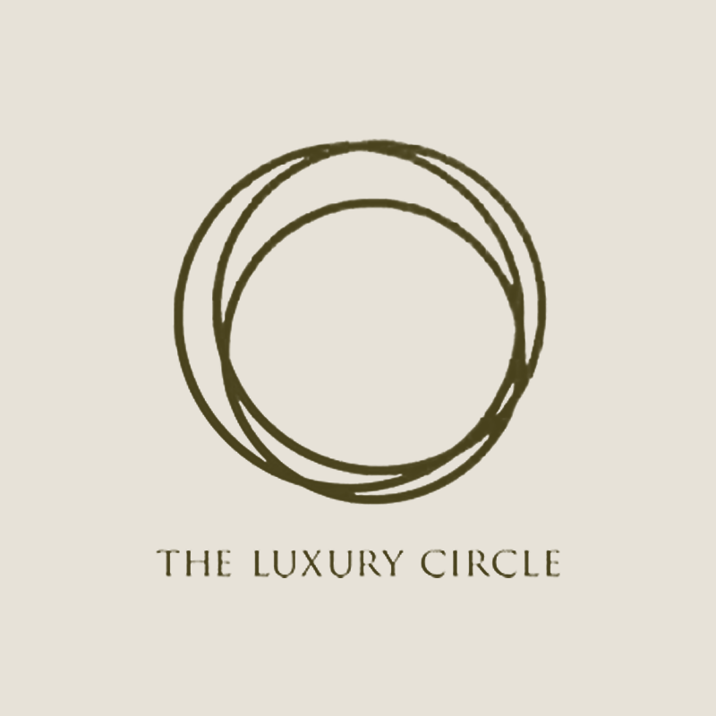 Logo with three intertwined circles above the text 'The Luxury Circle' on a light background.