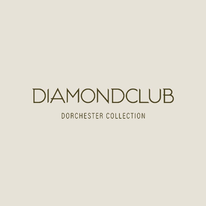 Logo for Diamond Club Dorchester Collection with beige background and stylized text.