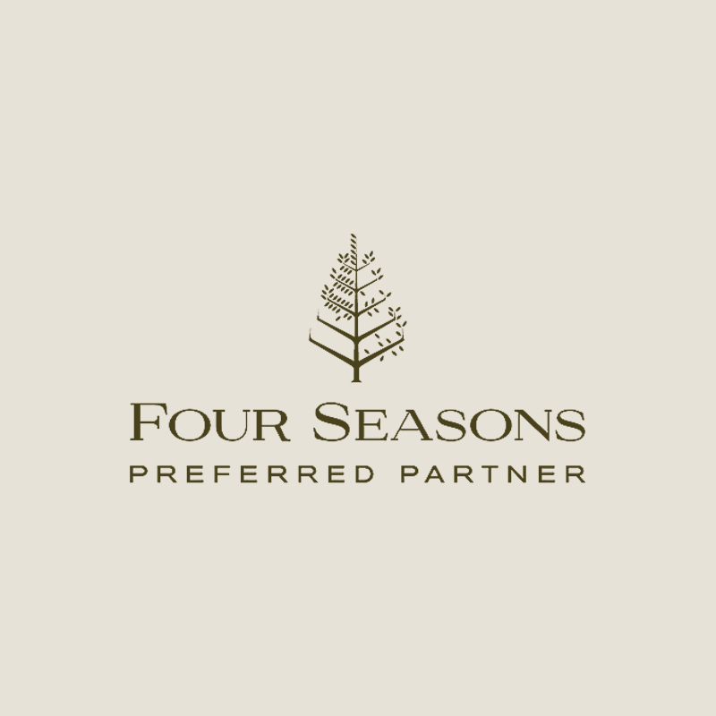 Logo for Four Seasons Preferred Partner featuring a stylized tree design and text