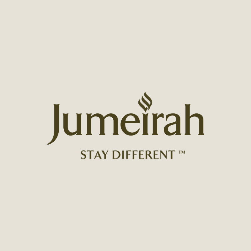 Jumeirah logo with a flame design above the letter 'i' and the tagline 'Stay Different'.