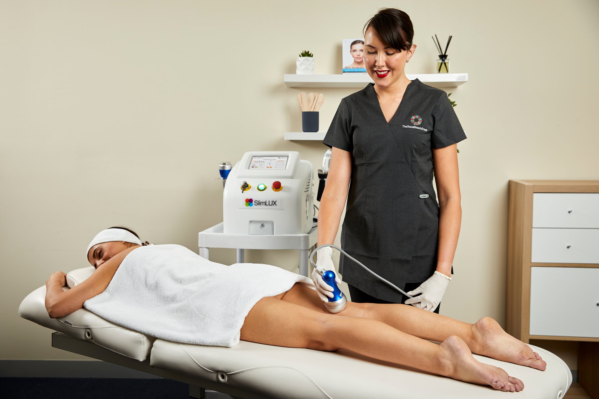 Woman having a vacuum suction cellulite reduction treatment on the back of her legs and buttocks in Canberra