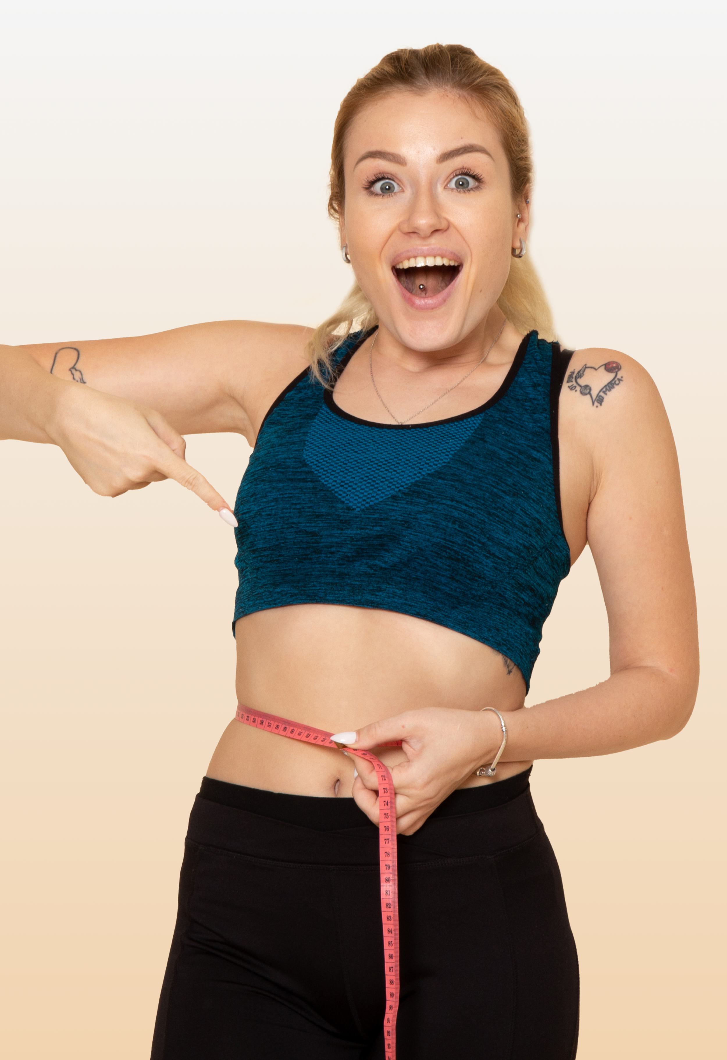 Woman measuring her waist showing off toned body