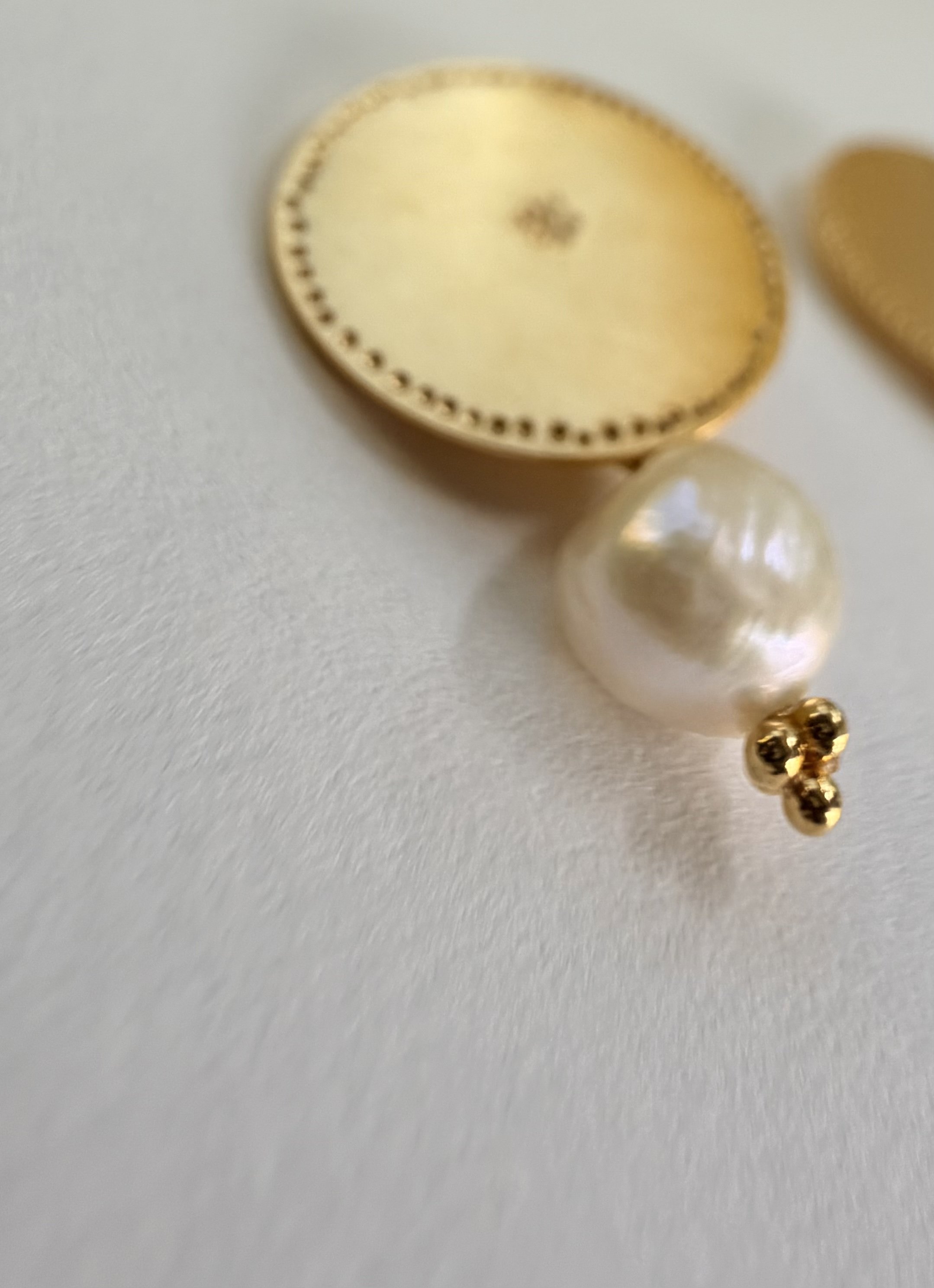 Detail of a Pearl Belak earring showing the natural lustre and irregular shape of the freshwater pearl.