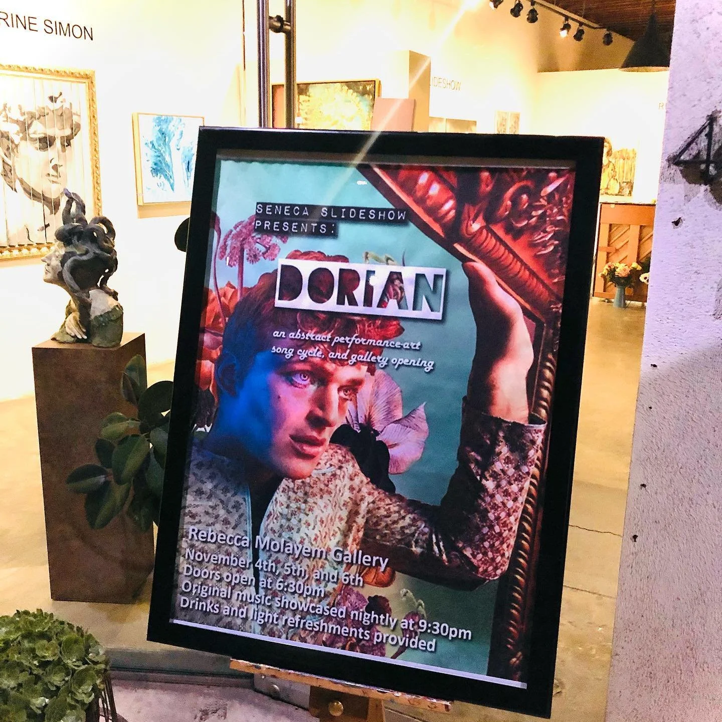 Event poster for Dorian art show at Rebecca Molayem Gallery, featuring Natti Vogel with makeup and a patterned jacket, holding a sword, with colorful collage-style background and event details at the bottom.