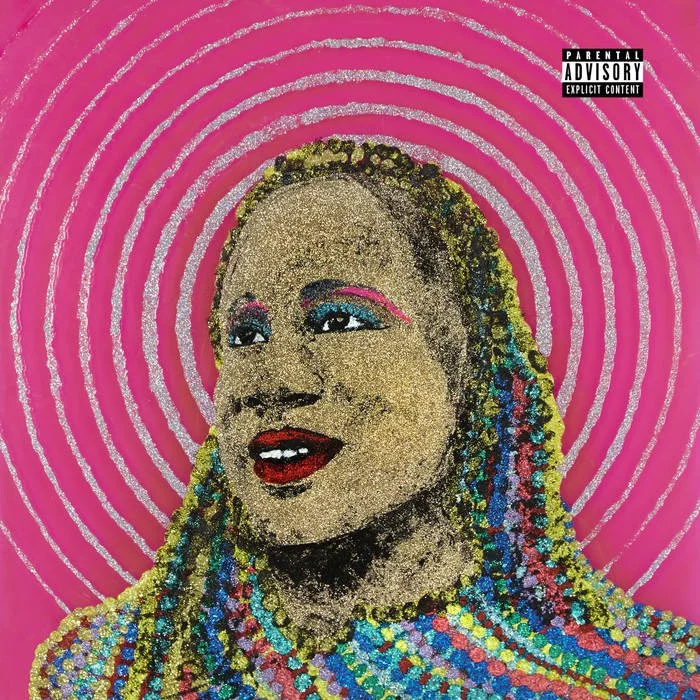 Portrait of a Michael Love Michael with multicolored braids lit up with glitter, against a pink background with concentric silver circles, and a parental advisory sticker in the top right corner. Album cover art.