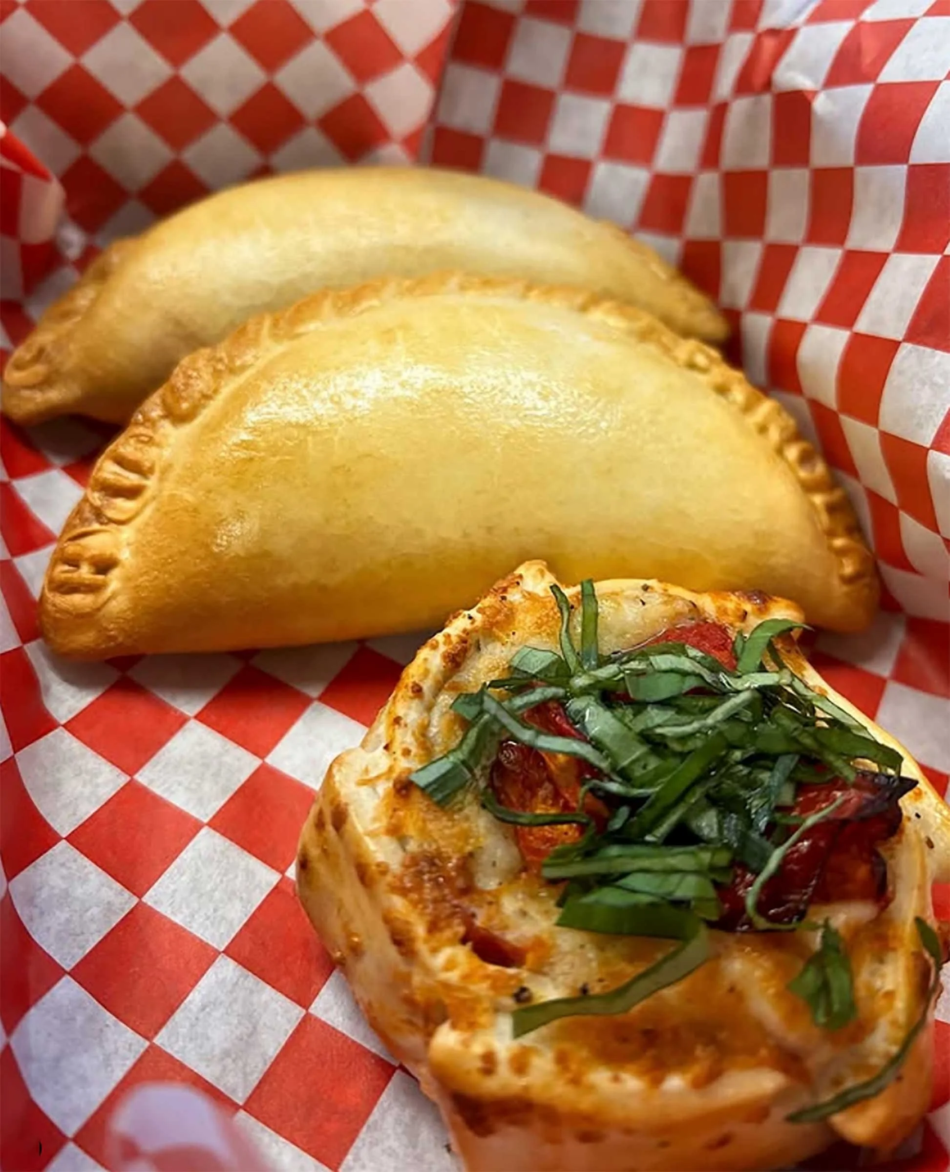 Two empanadas and a canastita.