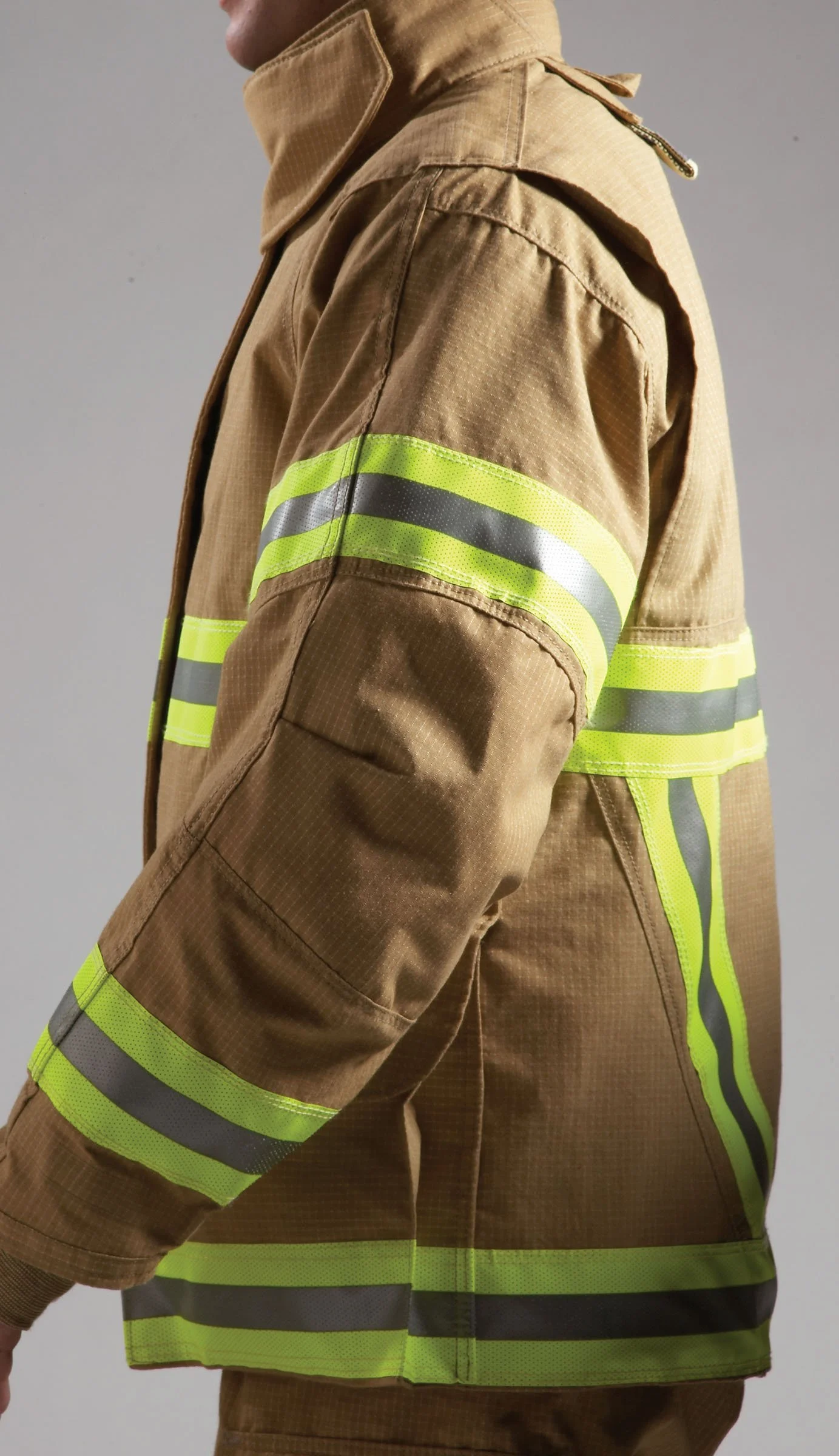 A person wearing a tan firefighter uniform with reflective yellow and gray stripes.