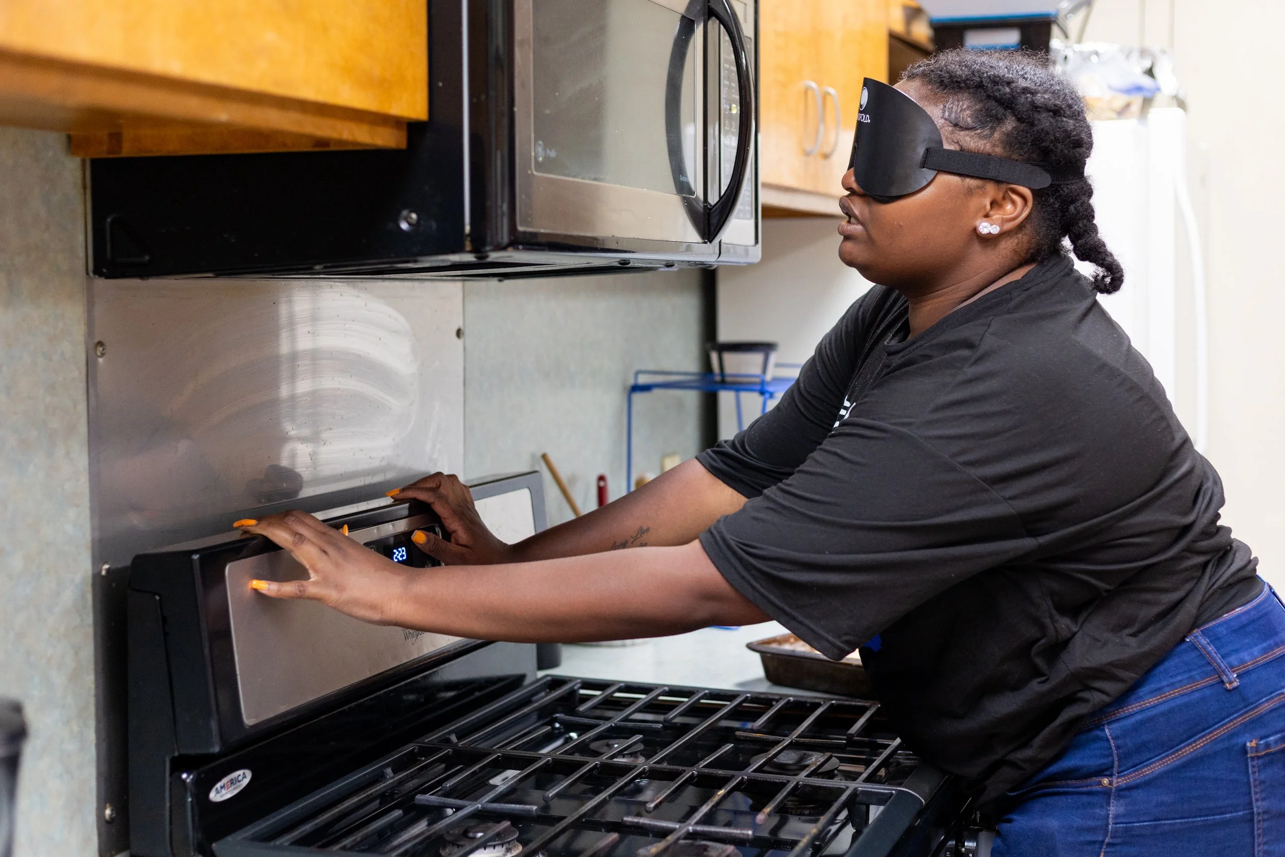 Student setting the oven in home management