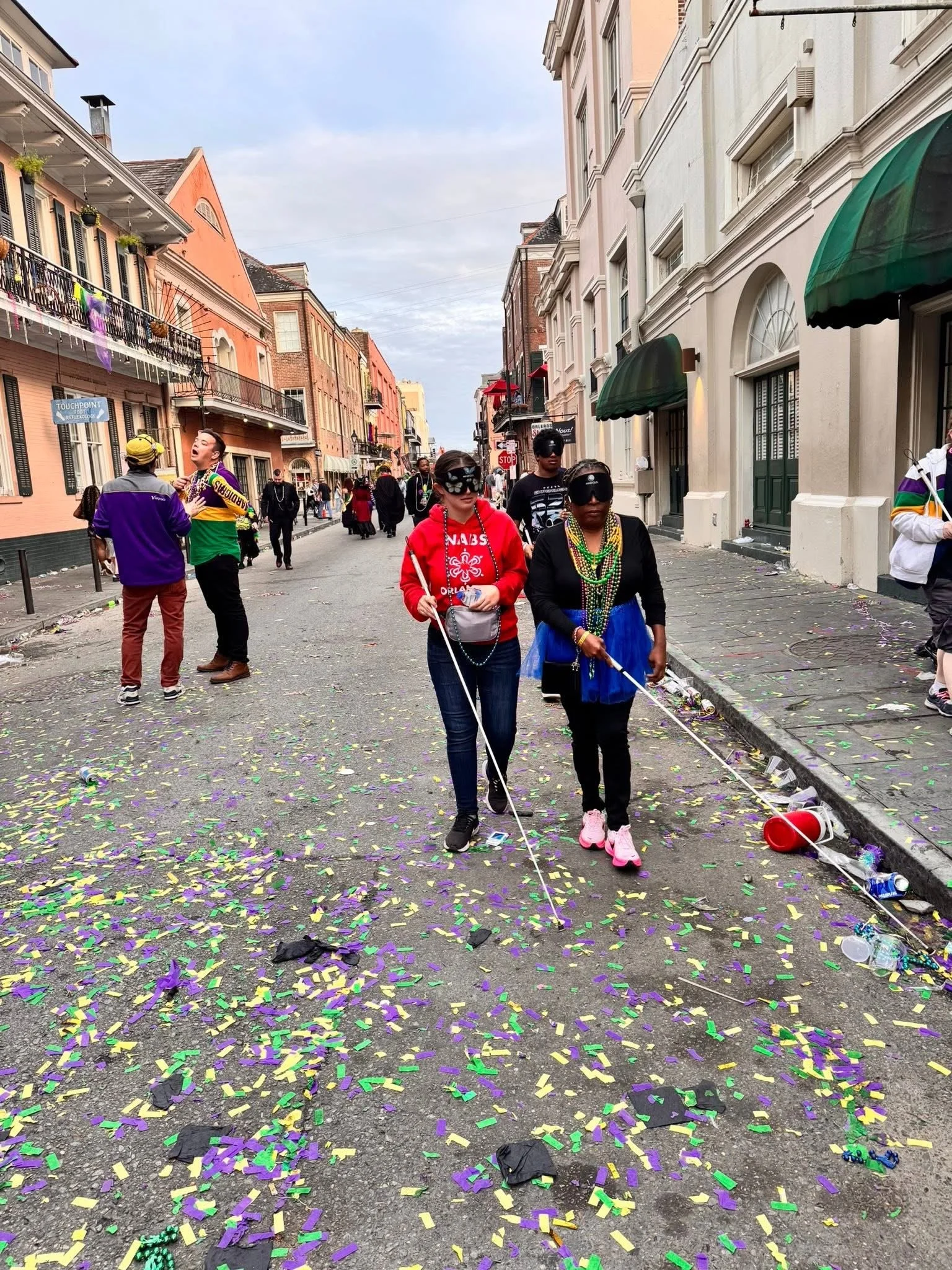 Students exploring French Quarter in New Orleans during Mardi Gras