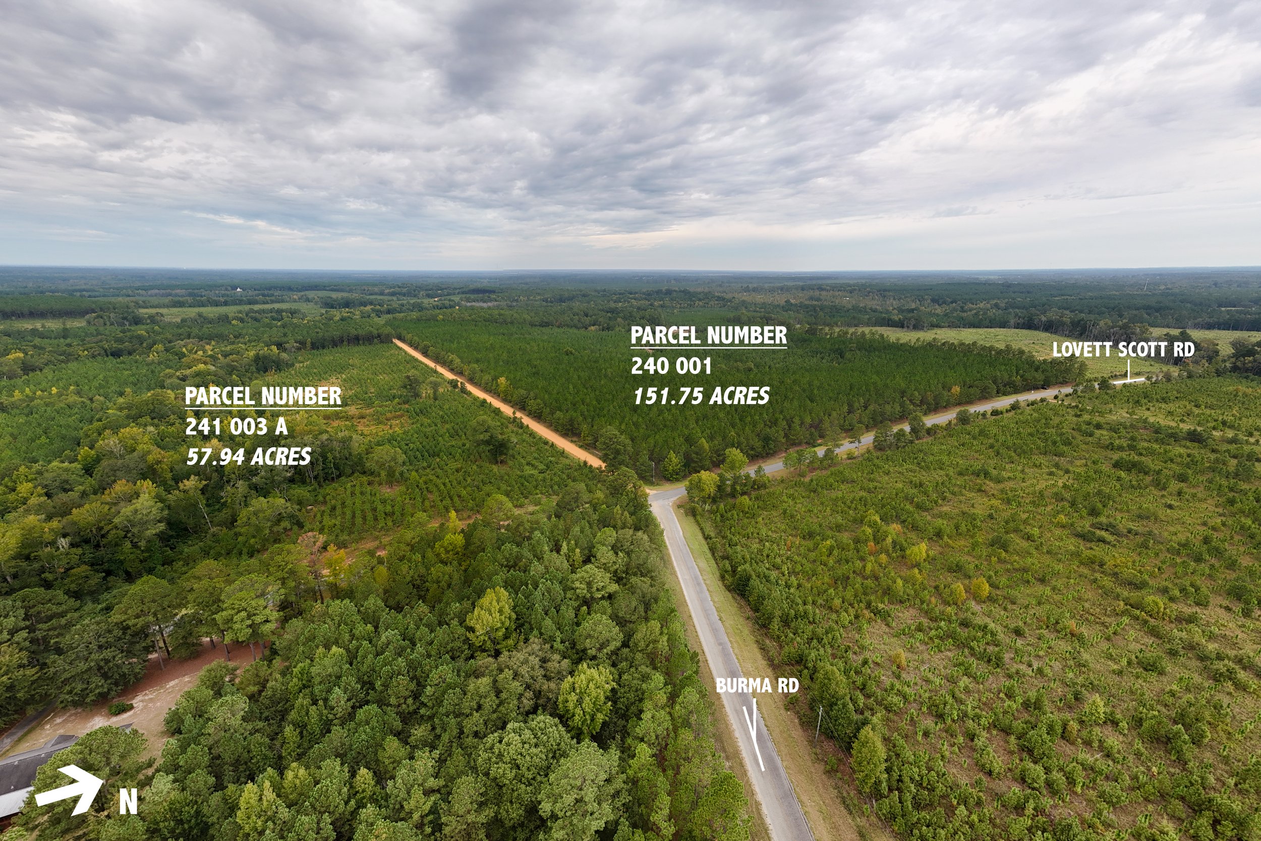Aerial view of a large forested area with labels indicating property boundaries and roads. Two parcels are highlighted: one with parcel number 241 003 A, covering 57.94 acres, and another with parcel number 240 001, covering 151.75 acres. The parcels