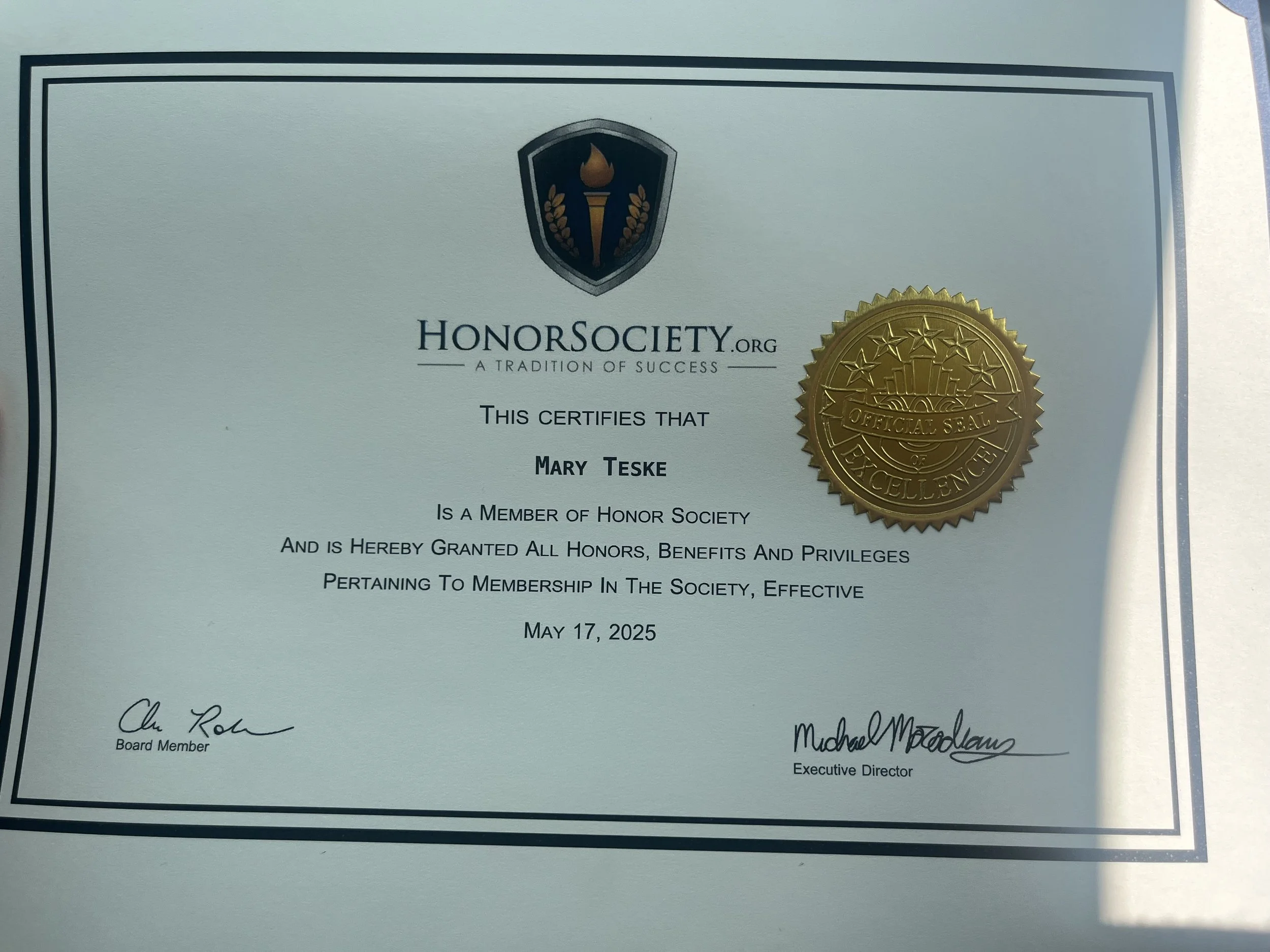 Certificate from Honor Society awarded to Mary Teske, effective May 17, 2025, with a gold embossed seal and the Honor Society logo at the top.