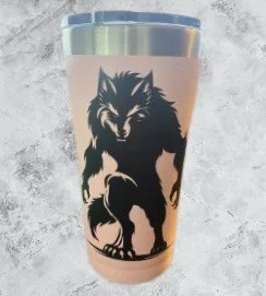 Coffee cup with a black and white wolf design on a beige background