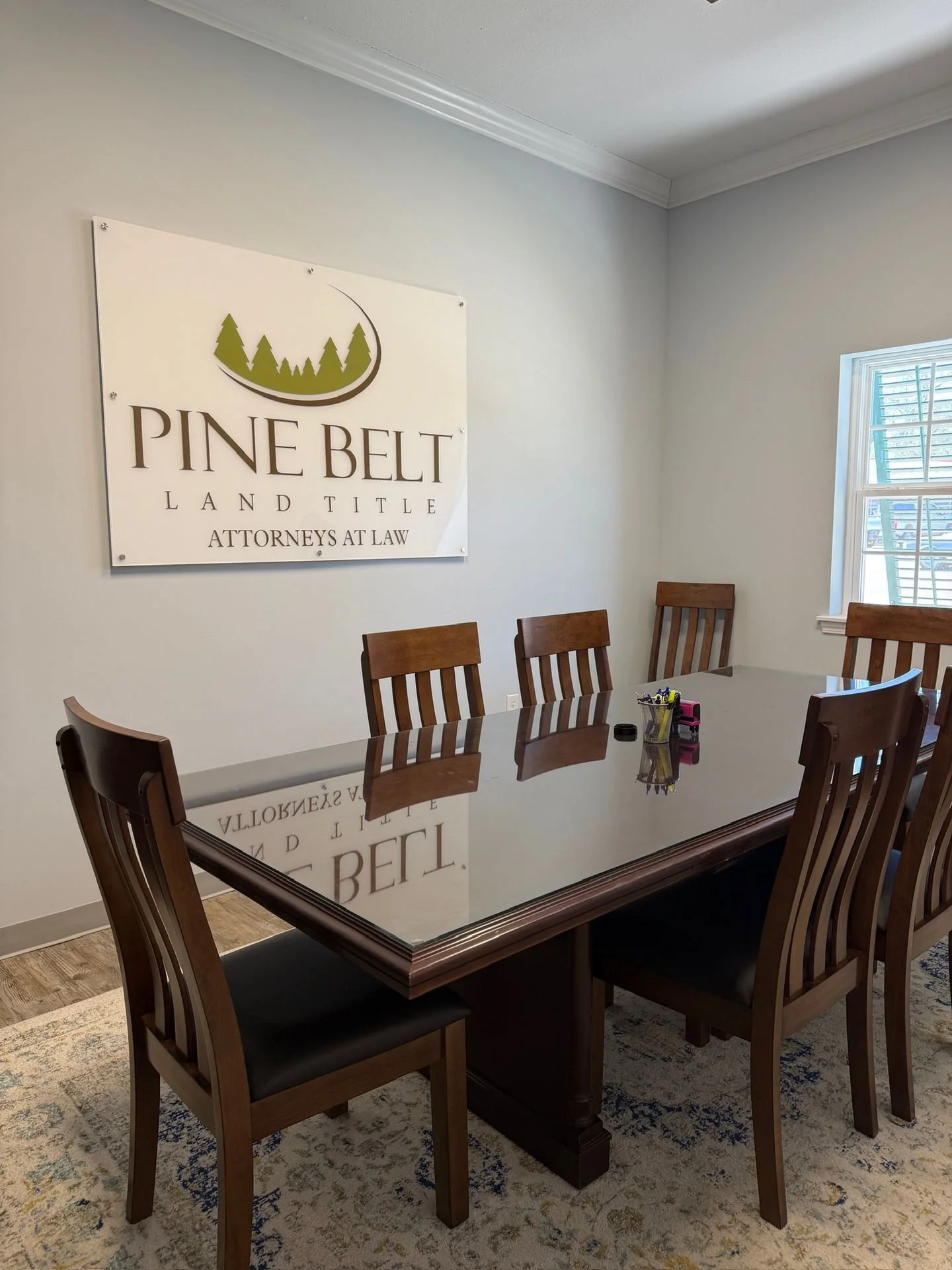 Step into the conference room and step closer to closing day. This is where Pine Belt Land Title reviews title searches, confirms deed information, and walks clients through the final paperwork of a real estate closing. Every detail matters here, and