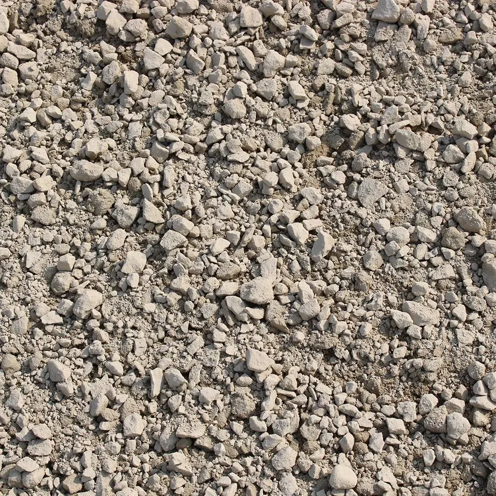 Close-up of a dirt surface with small to medium-sized rocks scattered across it.