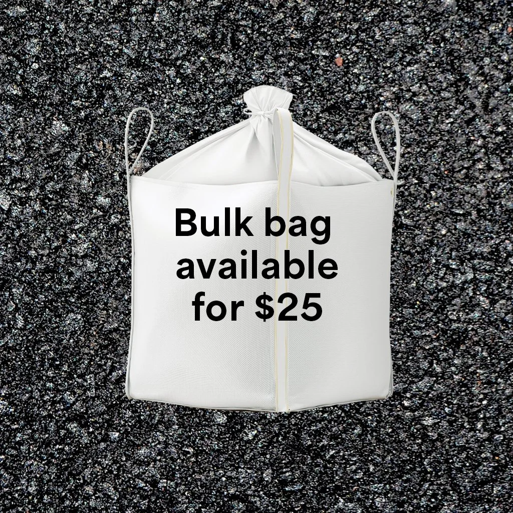 Close-up of sandy beach with footprints.