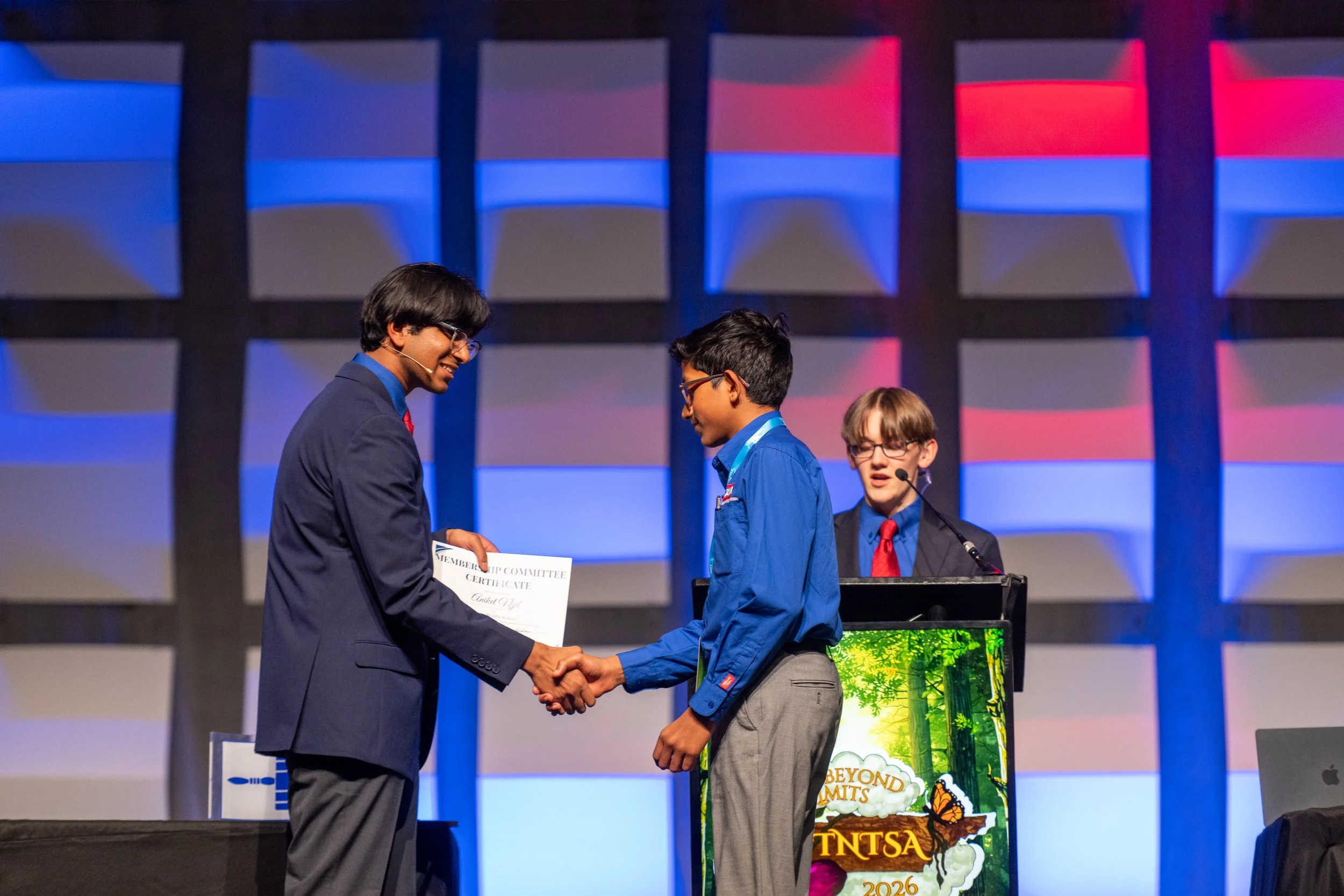 Two TSA members give a presentation in front of a volunteer judge.