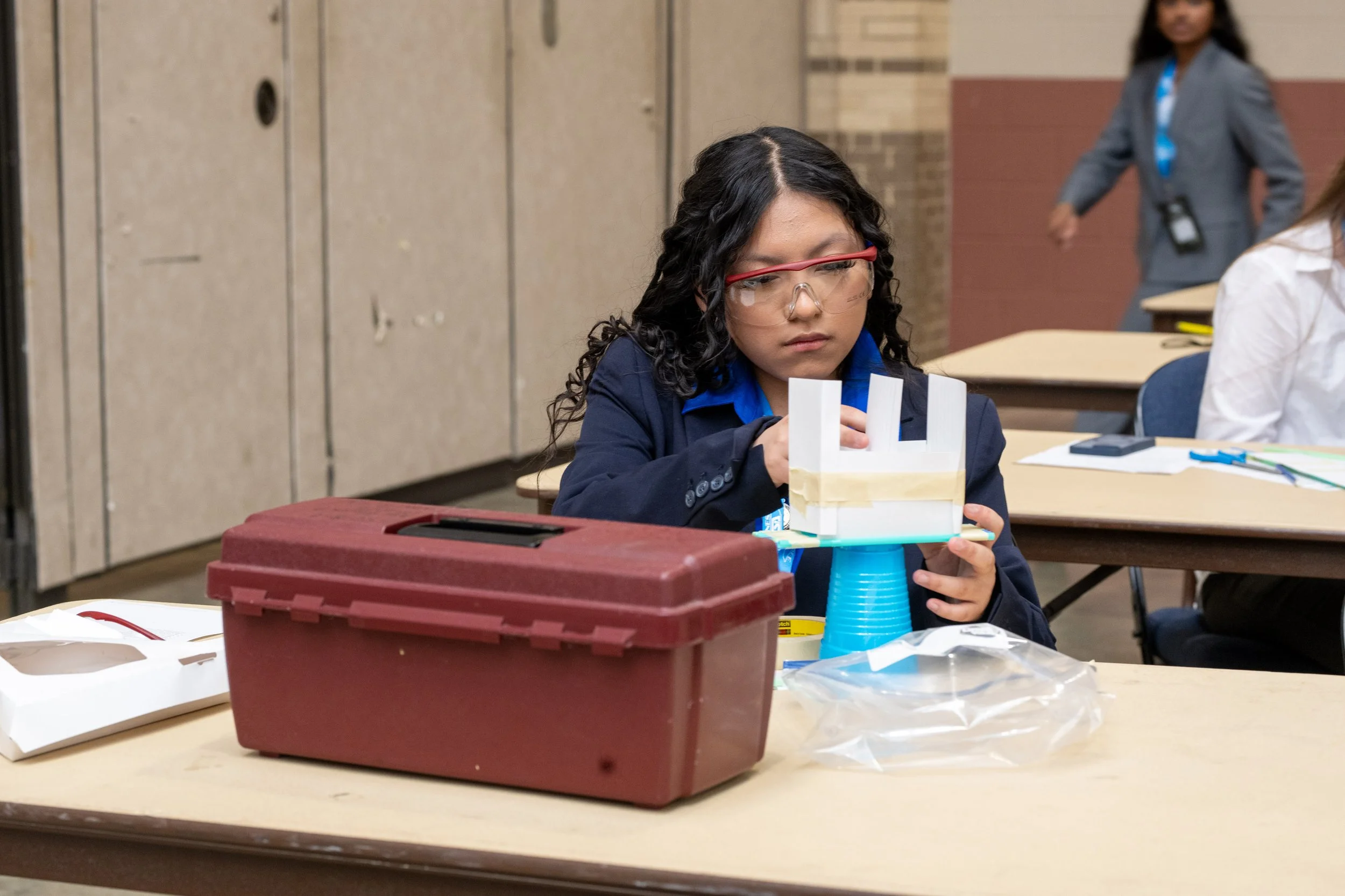 Two TSA members work on a robot during competitive events at the State Leadership Conference.