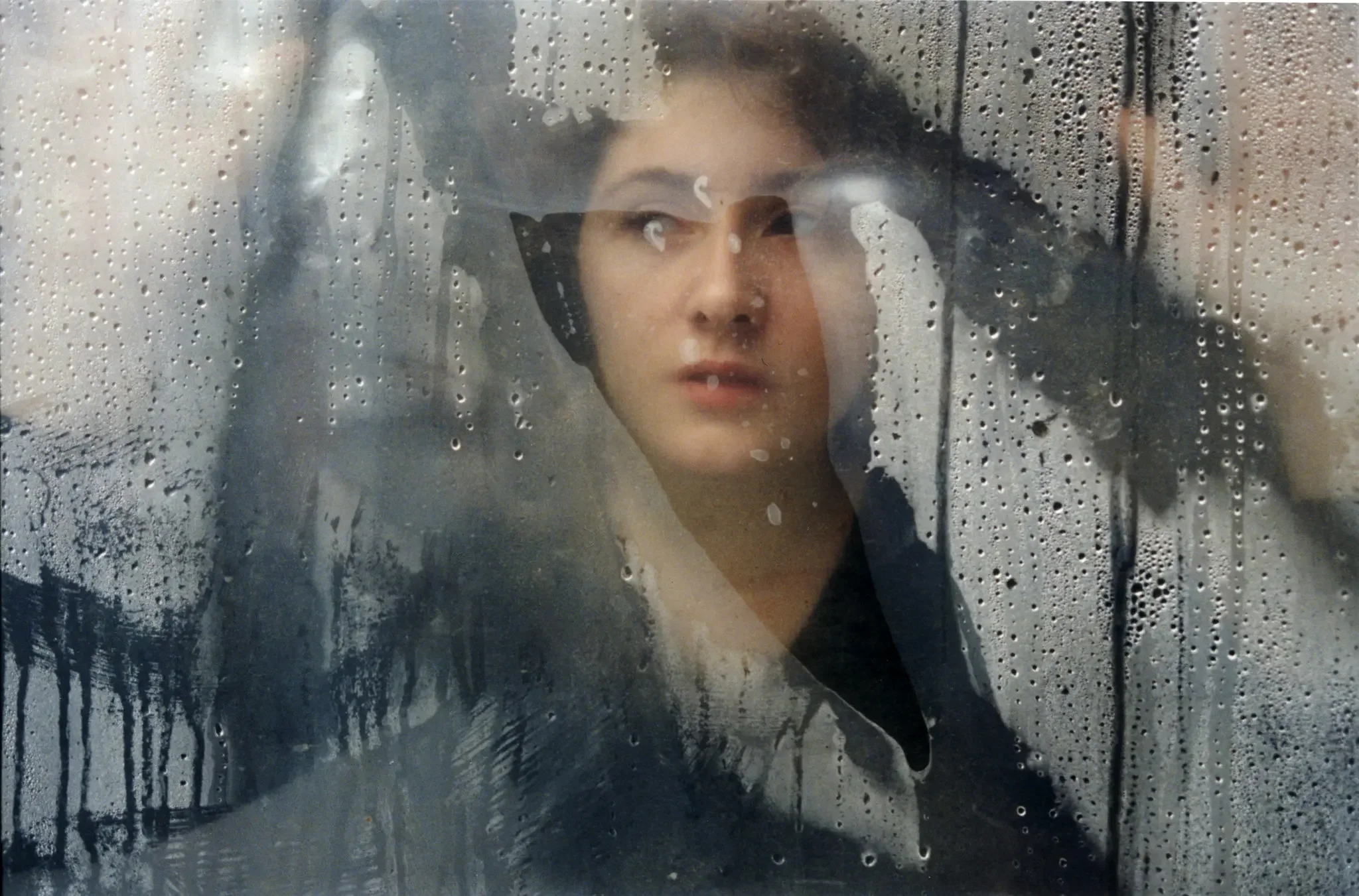 Since the death of her child, Zelina often stares at something far away, elusive. She says she is already dead herself, if only time would hurry up. Grozny, April 2001.